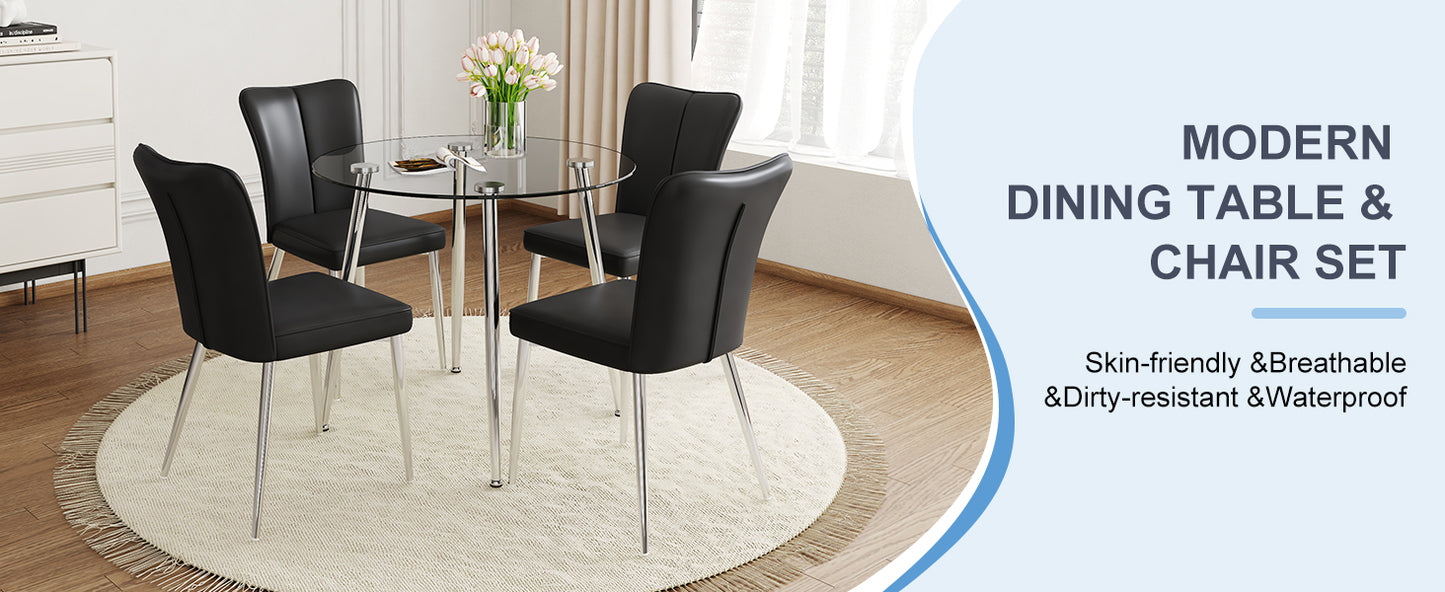 Black faux leather dining chairs and round glass tabletop with chrome legs