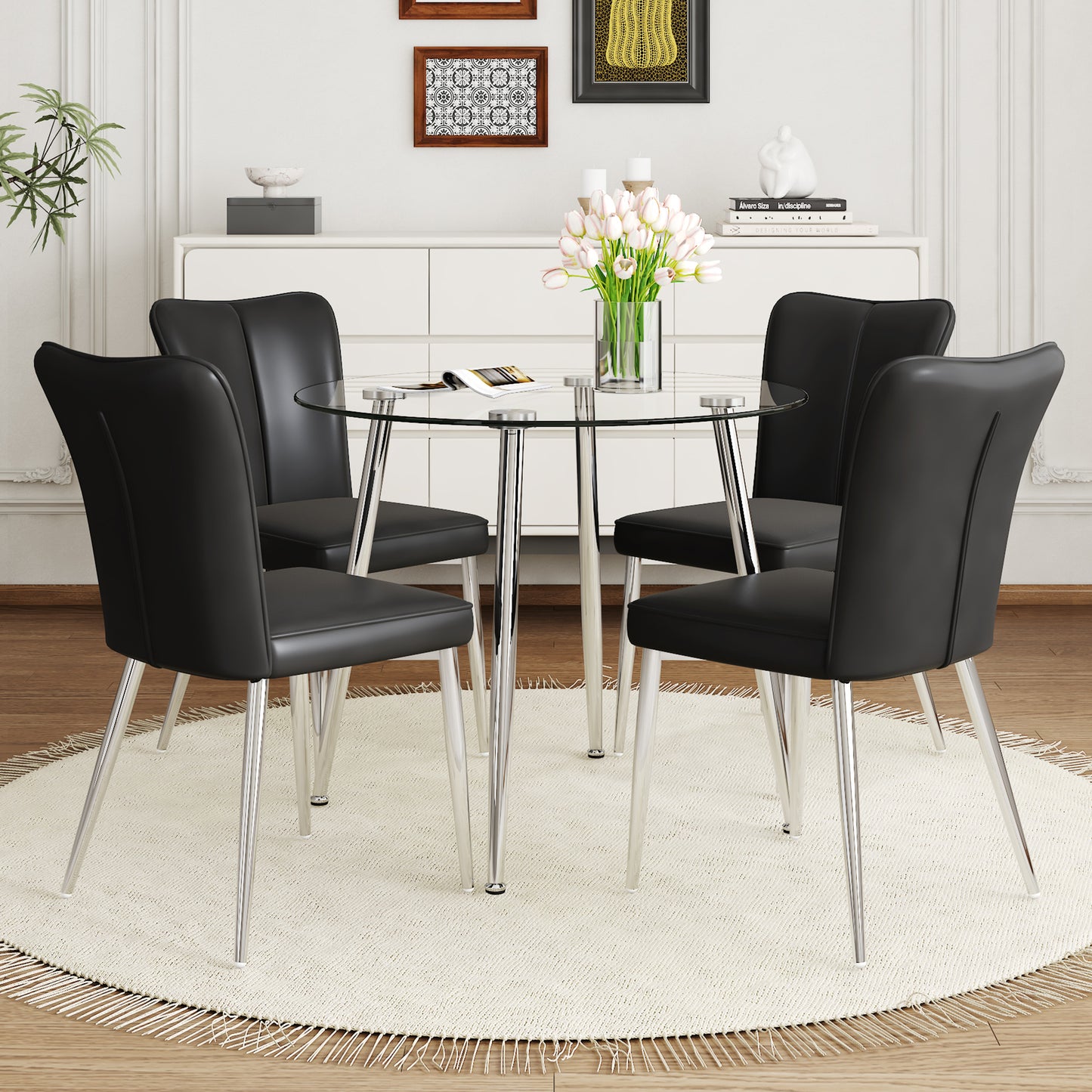 Black upholstered dining chairs with chrome legs around a round glass dining table