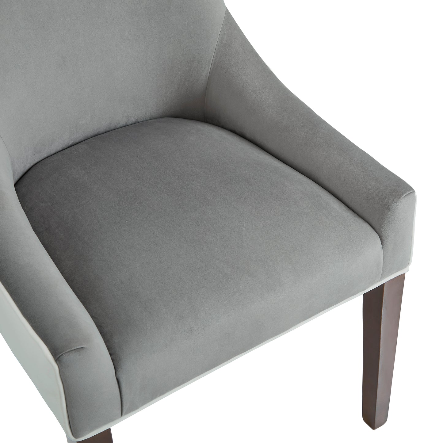 Close up of grey velvet armchair seat with wooden legs