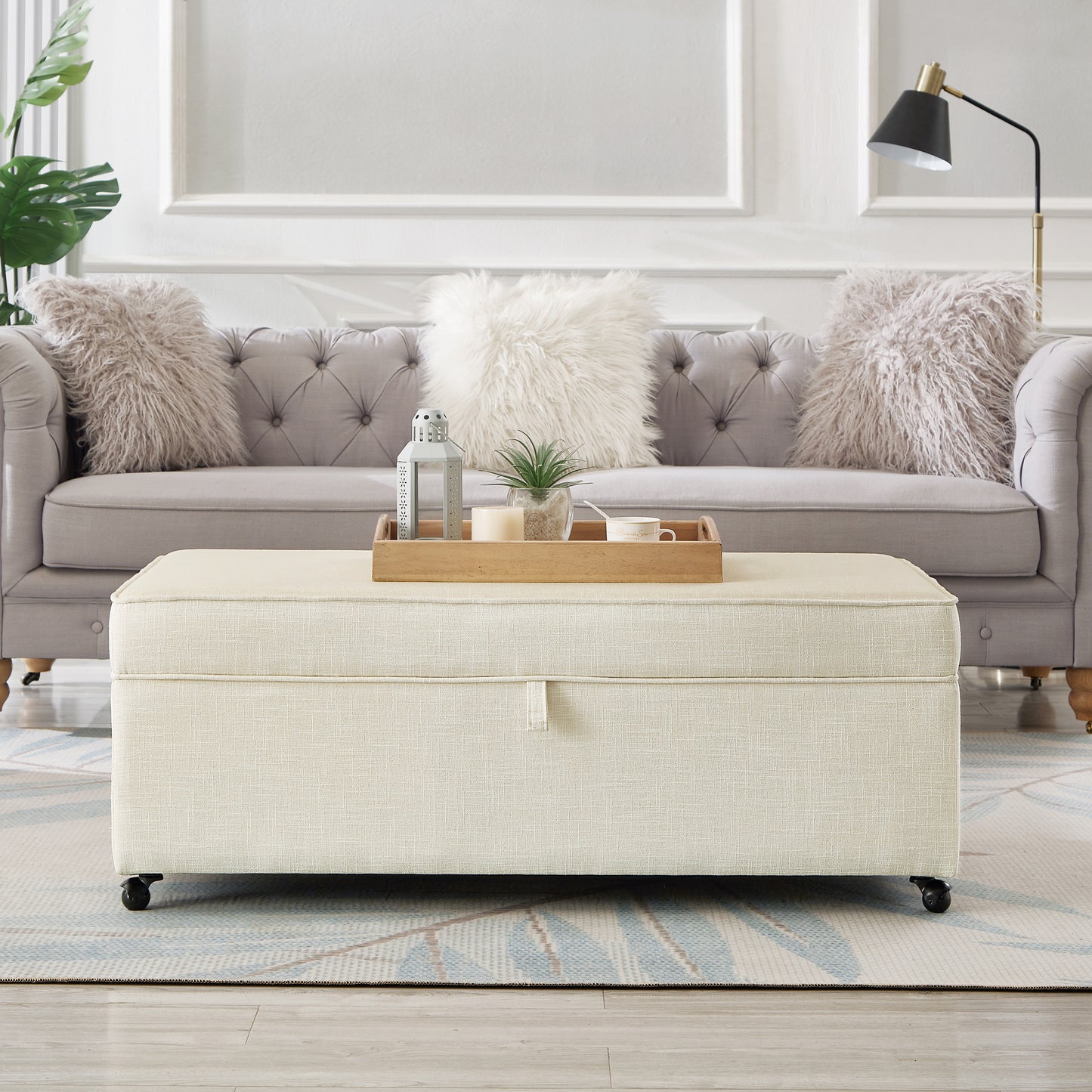 Upholstered storage ottoman in beige fabric with tufted sofa