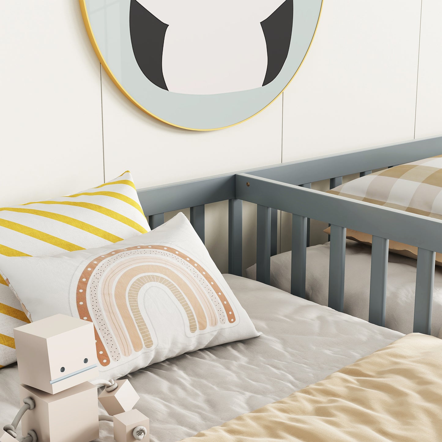 Gray wooden crib with white and yellow striped pillow
