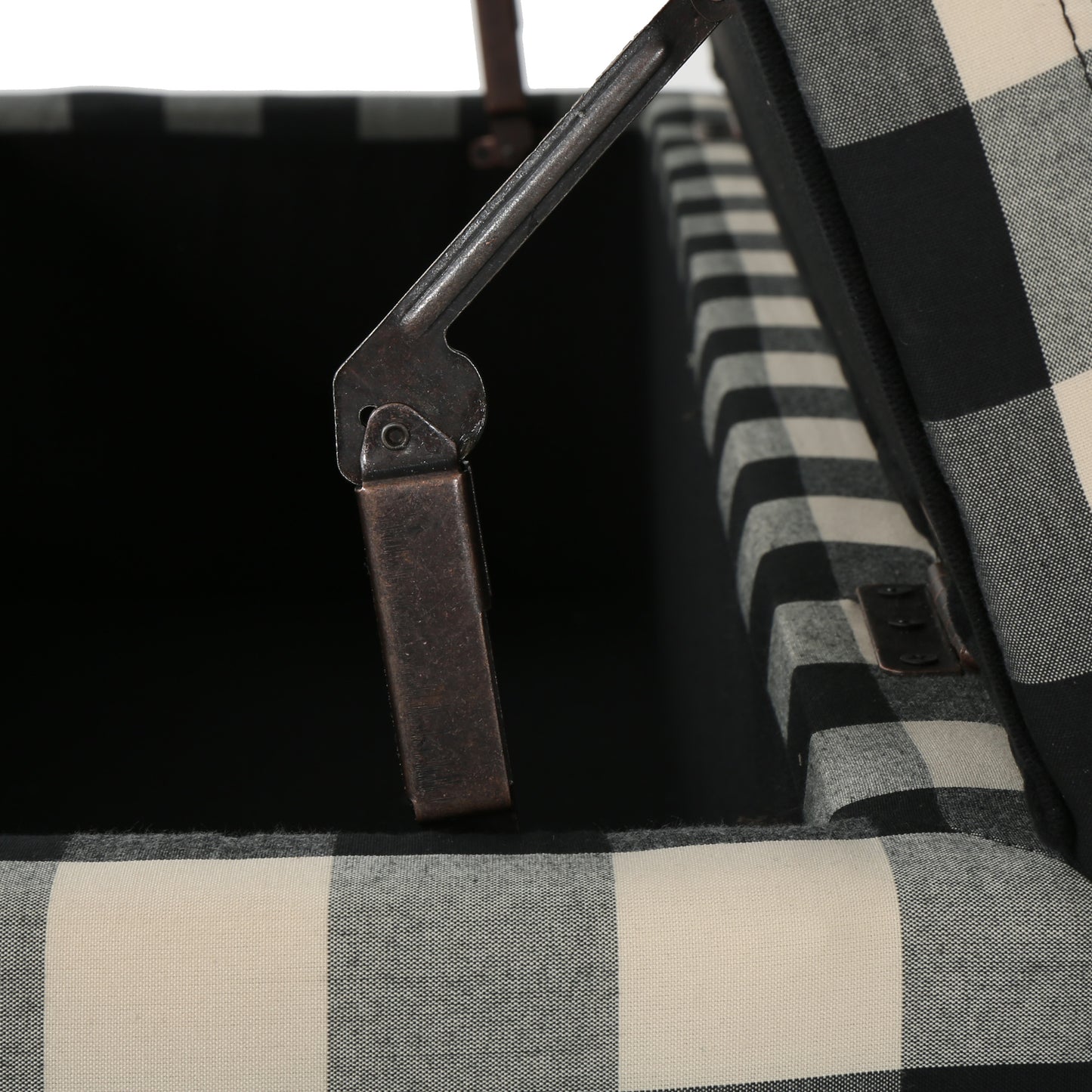 Black and white buffalo check storage ottoman interior with metal hinges