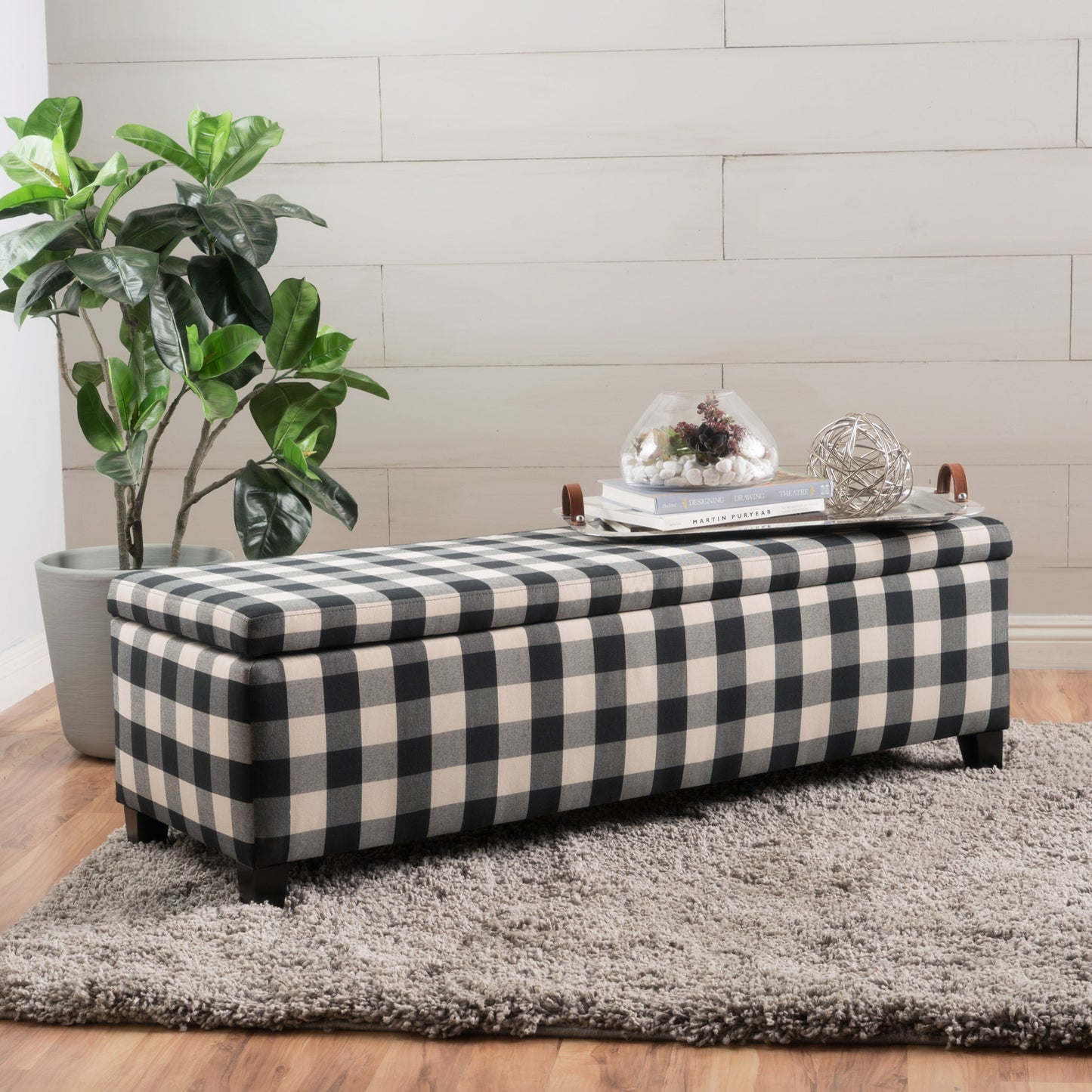 Black and cream buffalo check storage ottoman with dark wood legs