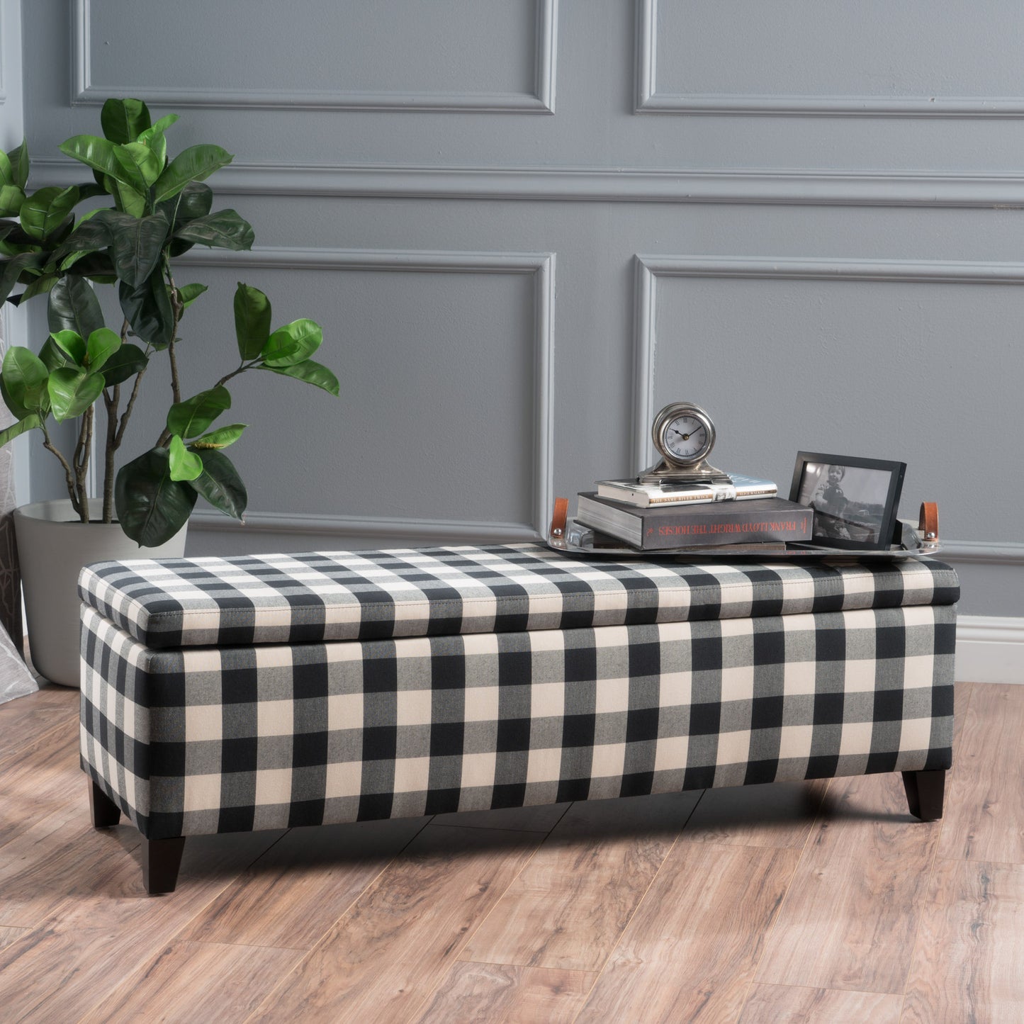 Black and white buffalo check storage bench with dark wood legs