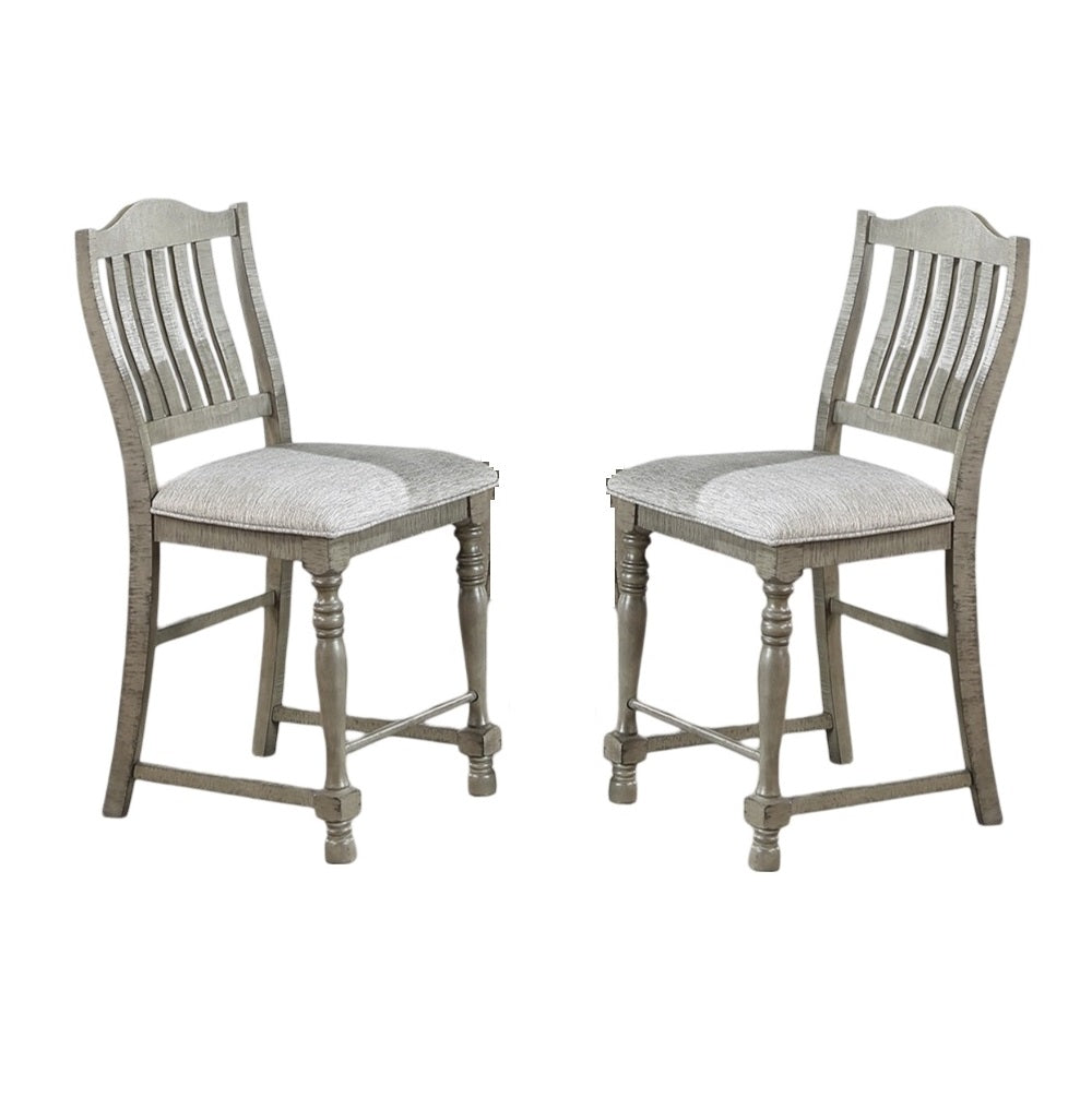 Two weathered grey wooden bar stools with upholstered seats