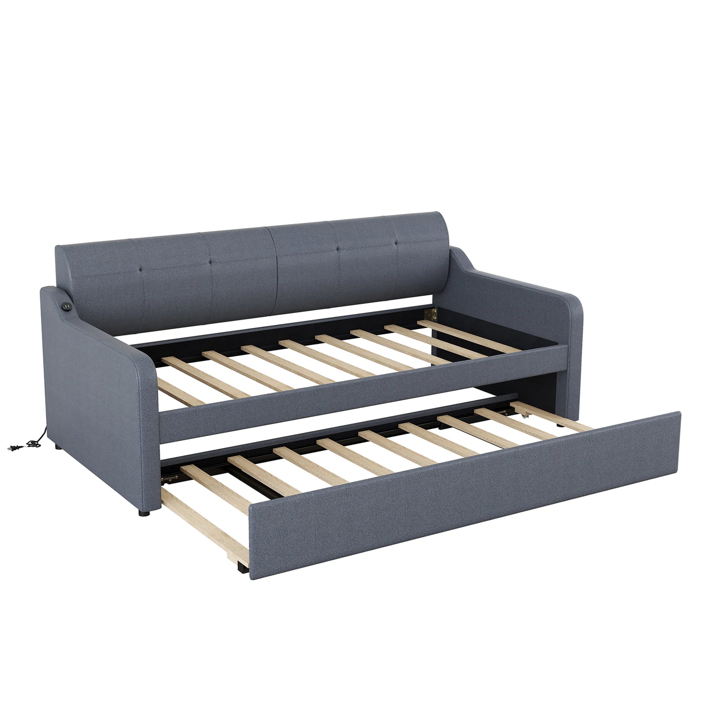 Grey upholstered daybed with pullout trundle extended and exposed wooden slats