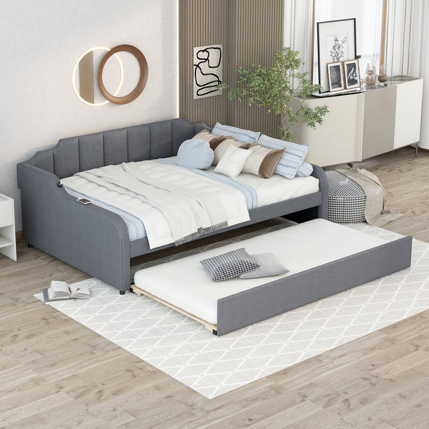 Grey upholstered daybed with pullout trundle perfect for guest room seating or sleeping