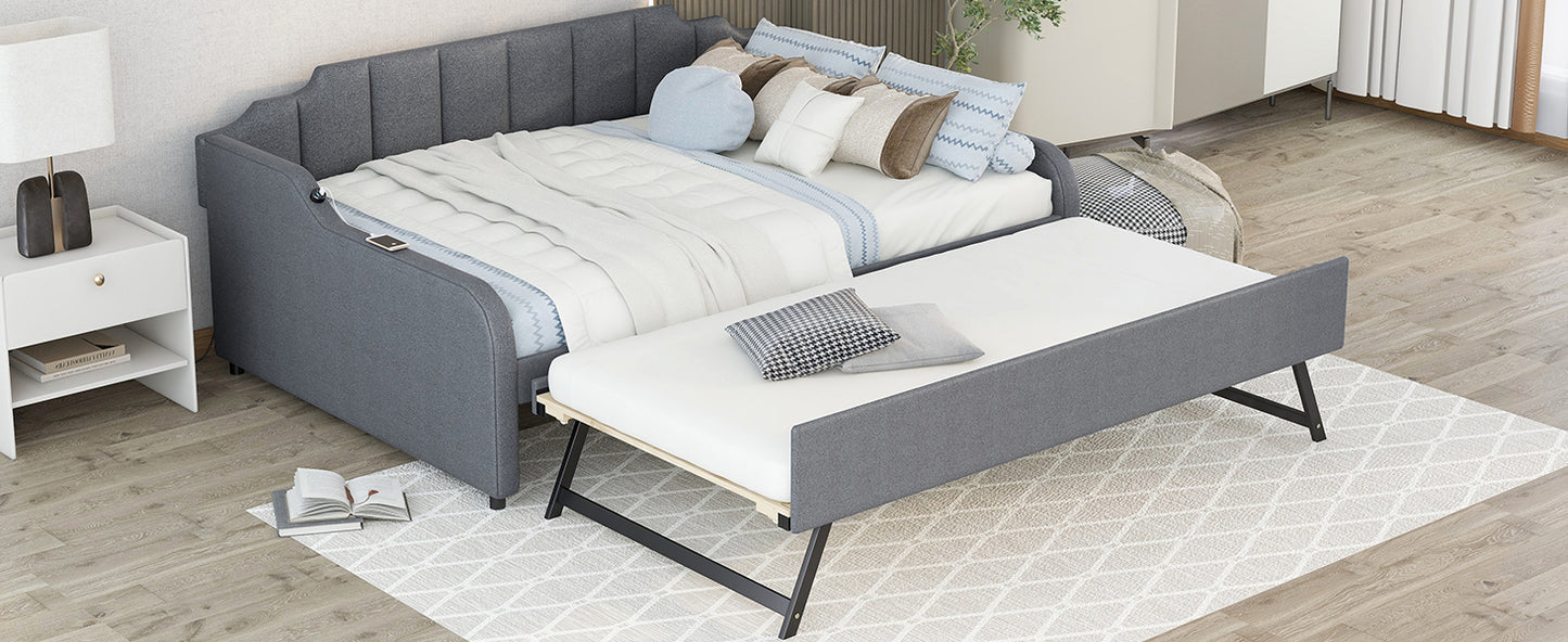 Gray upholstered daybed with pullout trundle perfect for small spaces