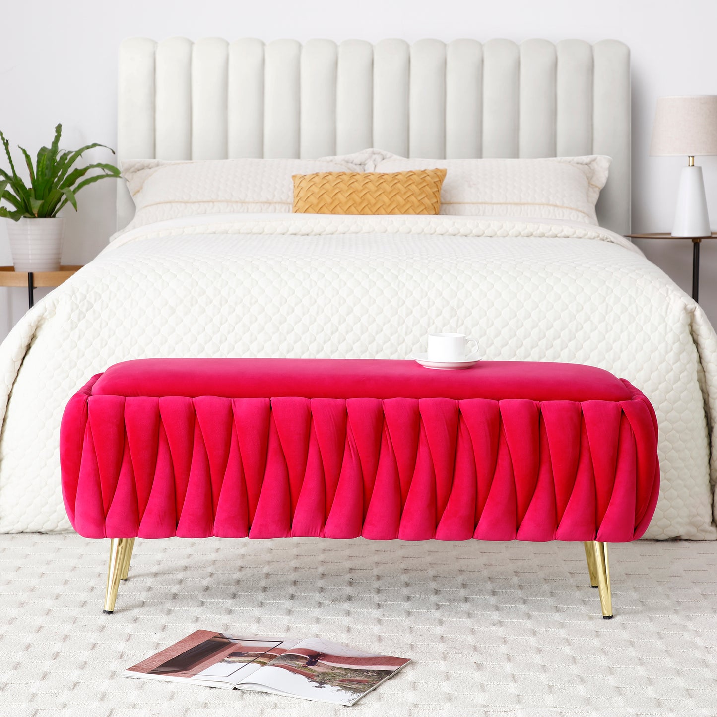 Velvet storage ottoman in vibrant pink with pleated design and gold legs