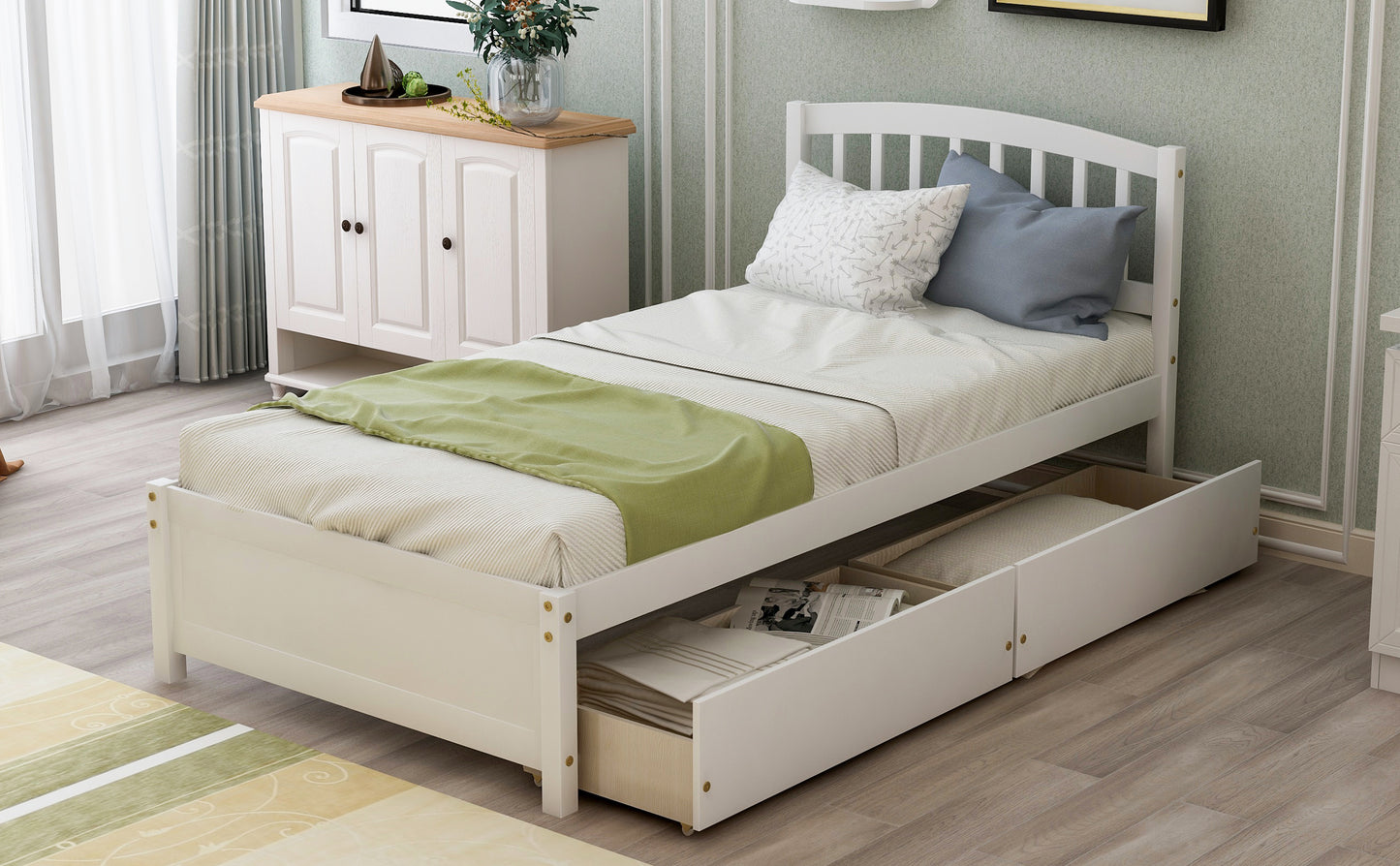 White twin bed frame with drawers and a green throw blanket