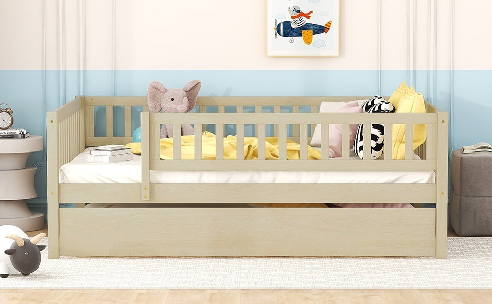 Wooden toddler bed with pullout drawer and guardrails