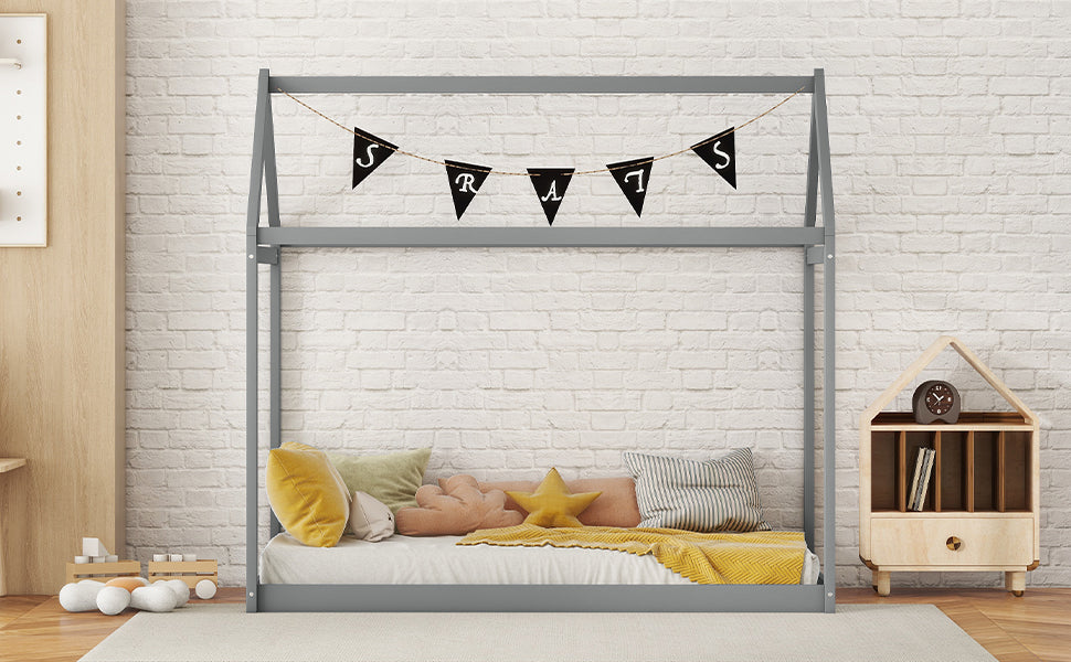 Gray wooden house bed frame with white bedding and yellow blanket