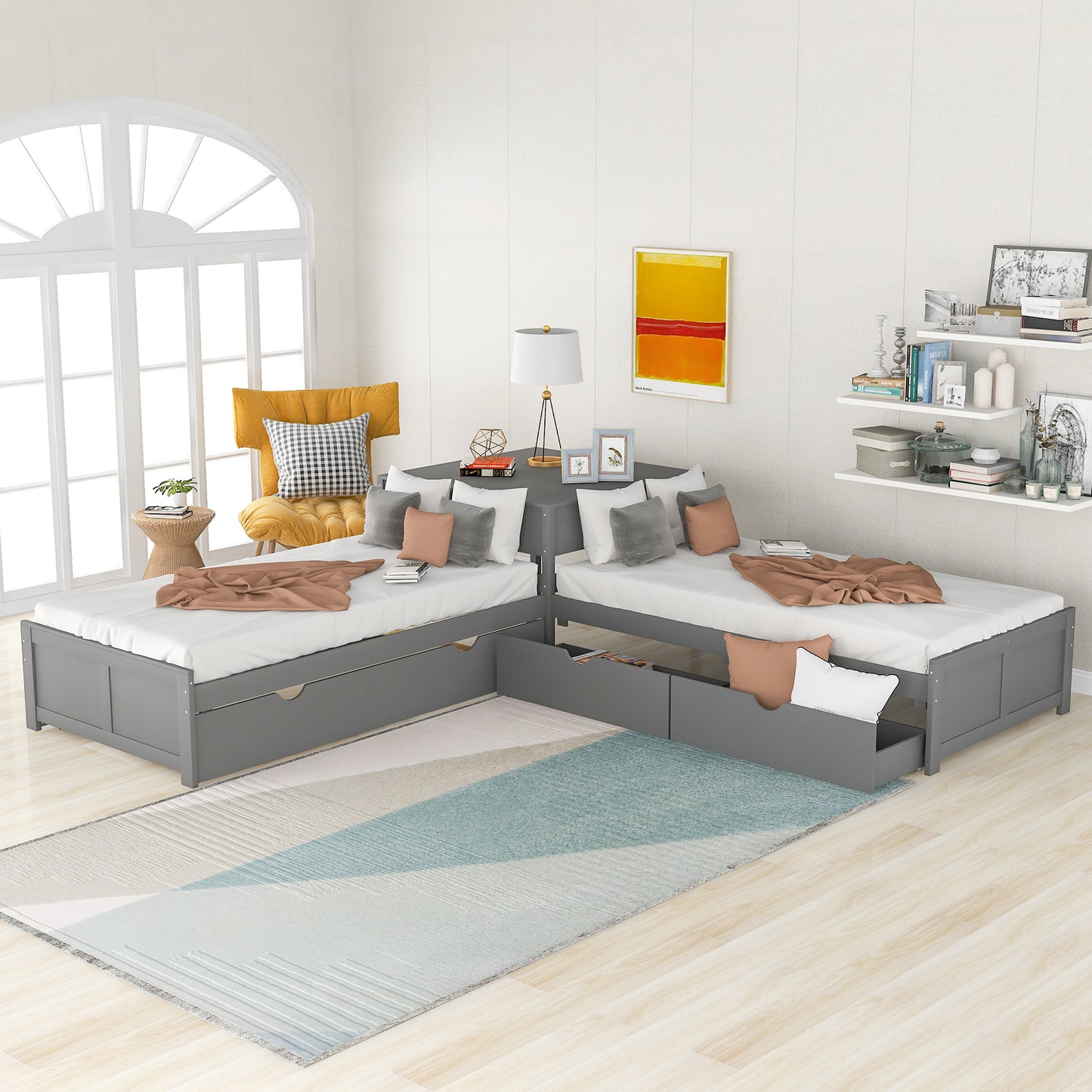 Grey wooden twin daybed with storage drawers and neutral linens ideal for small spaces
