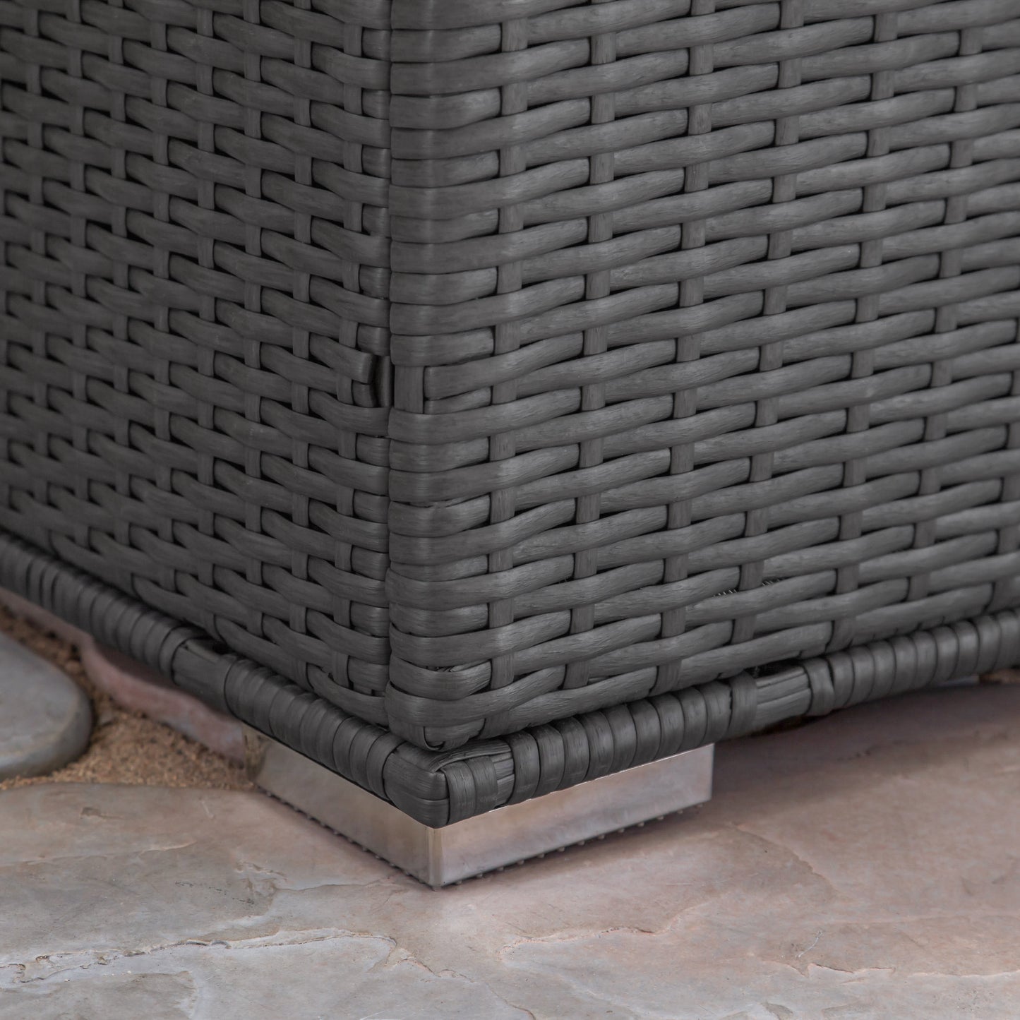 Closeup of grey rattan weave texture on outdoor furniture