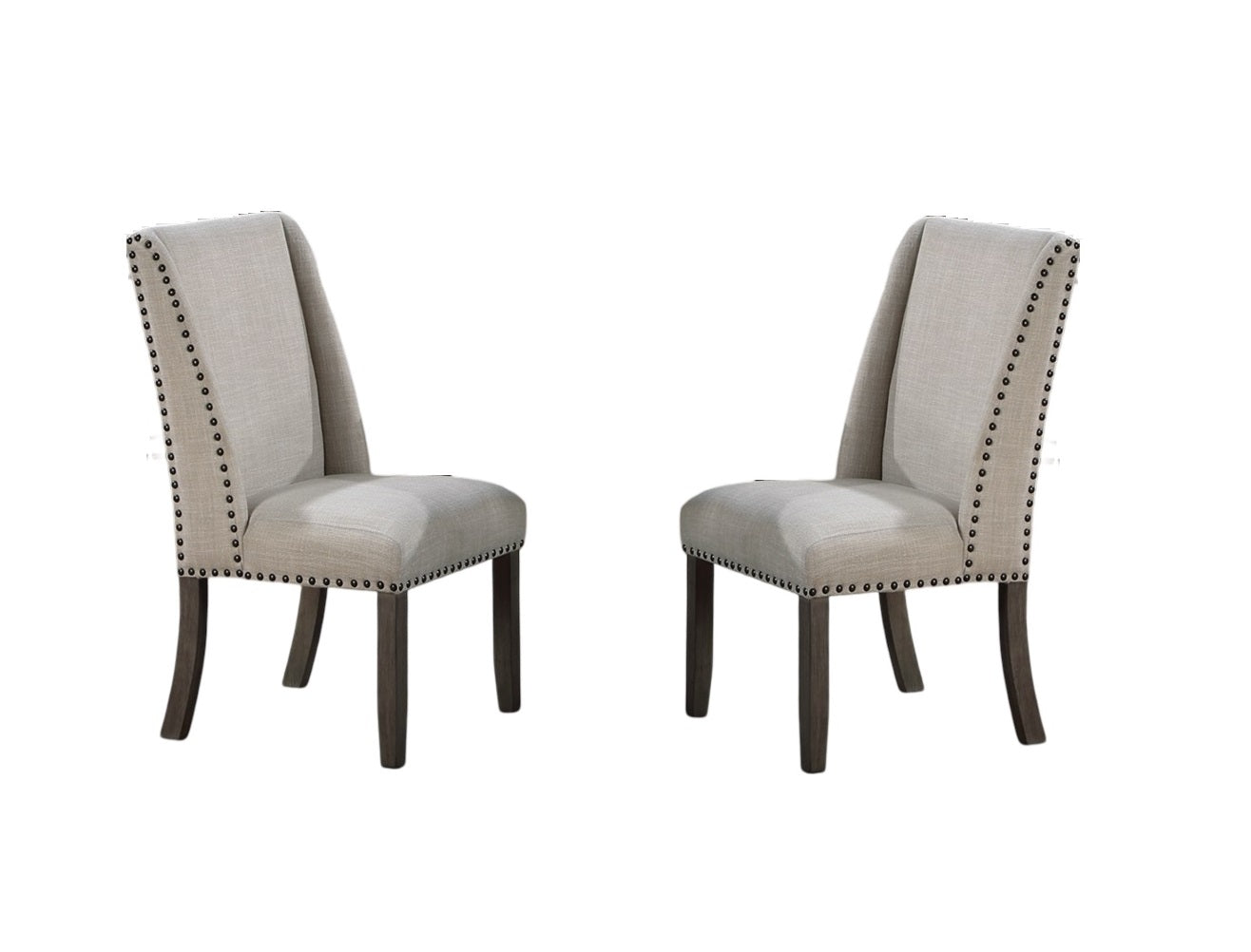 Two neutral beige linen upholstered dining chairs with dark wood legs and nailhead trim