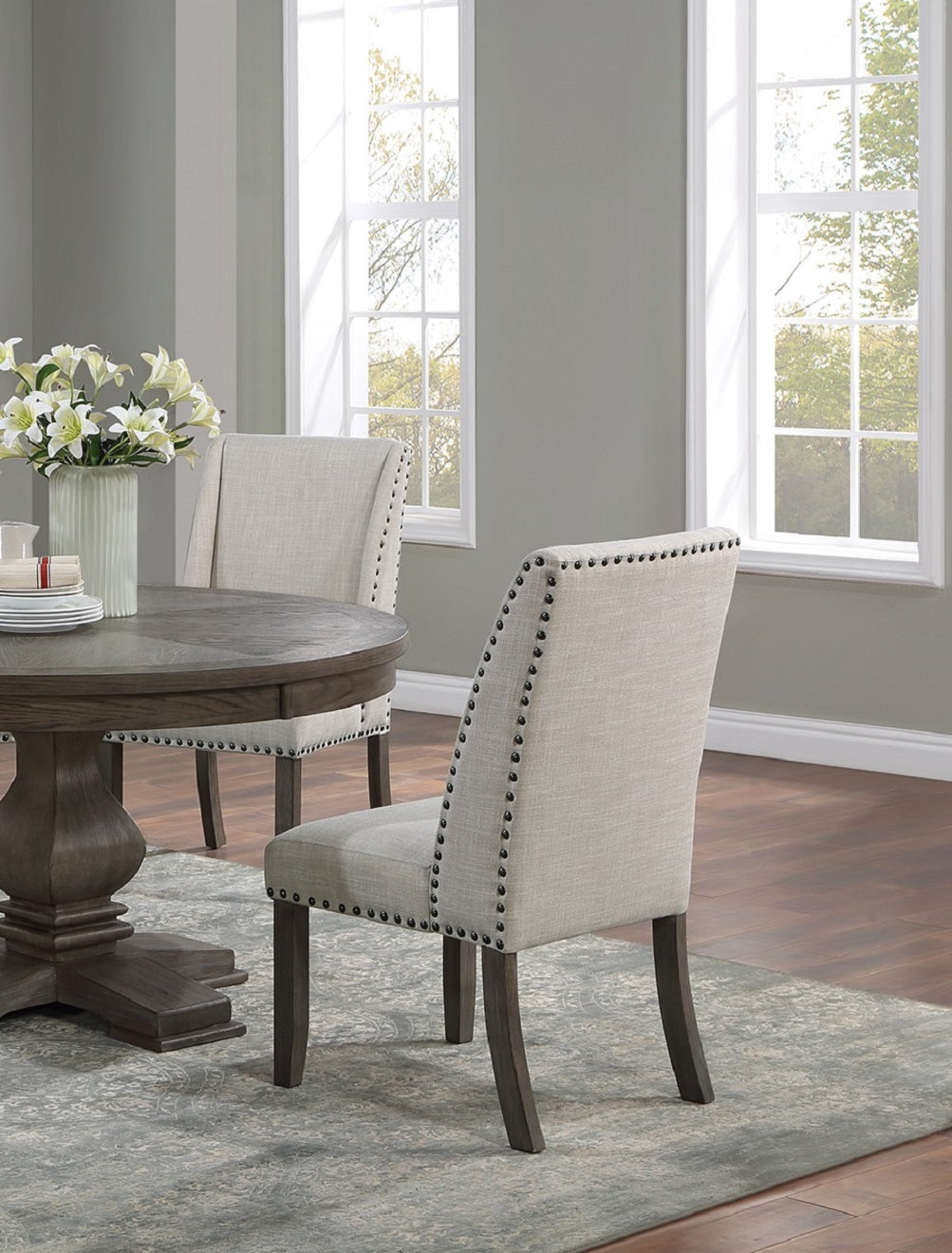 Tufted upholstered dining chair with nailhead trim in neutral fabric