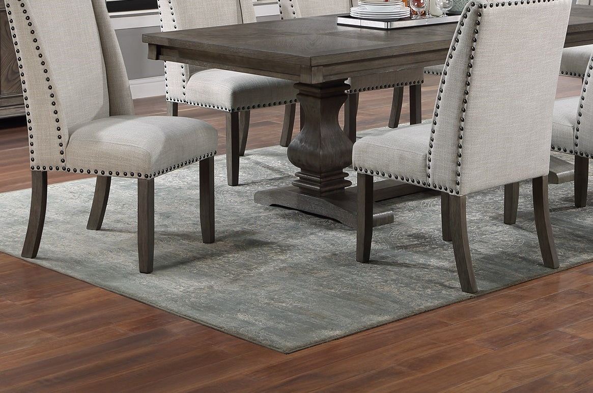 Upholstered dining chair with nailhead trim in light beige fabric