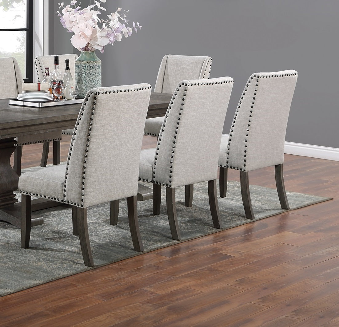 Upholstered dining chairs with nailhead trim