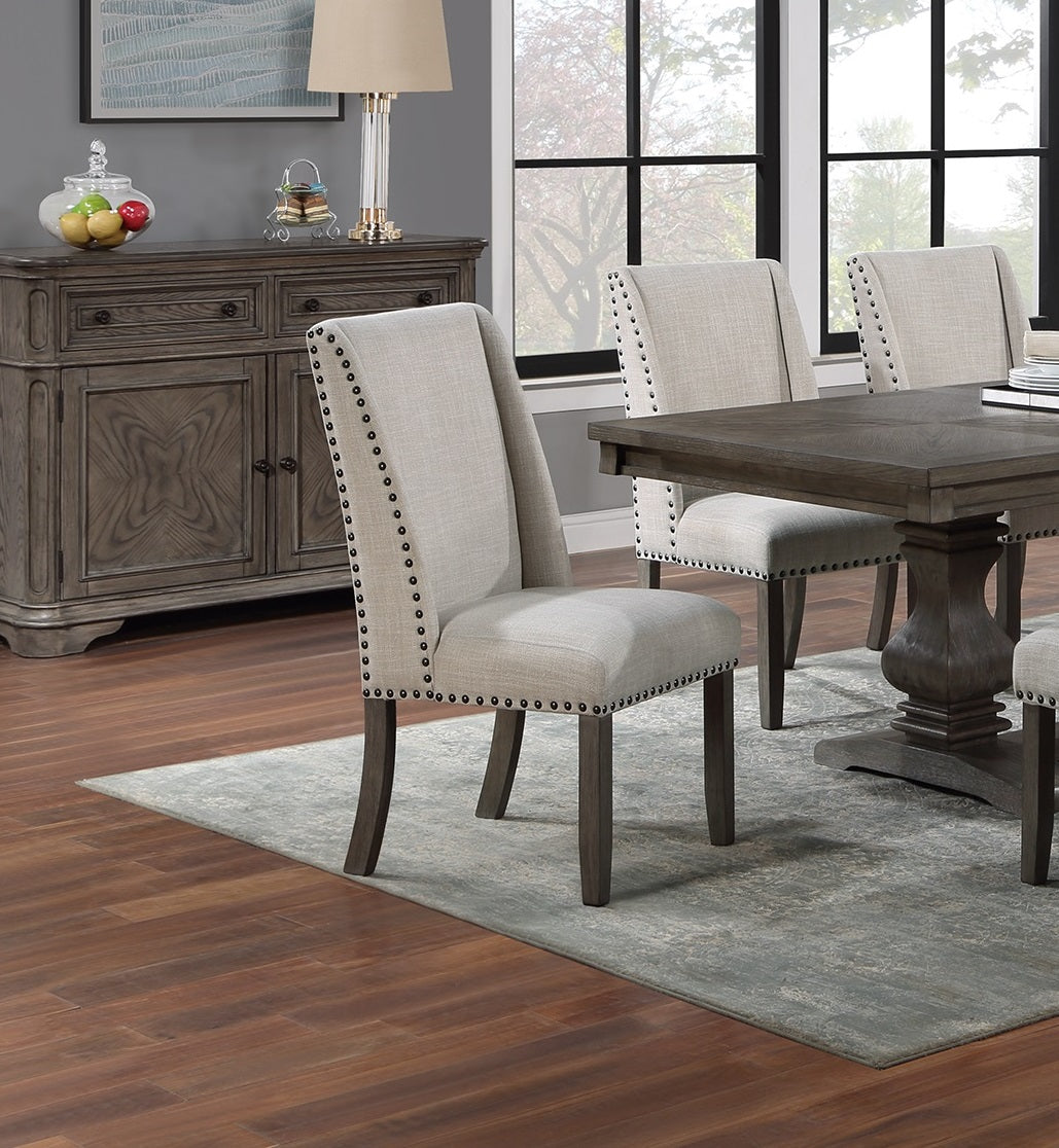 Upholstered dining chair with nailhead trim and gray fabric seat