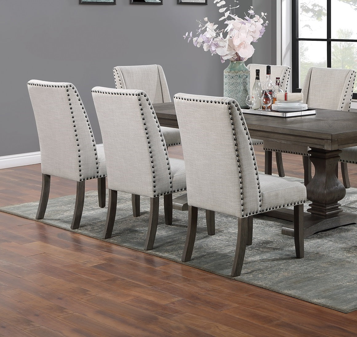 Upholstered dining chairs with nailhead trim