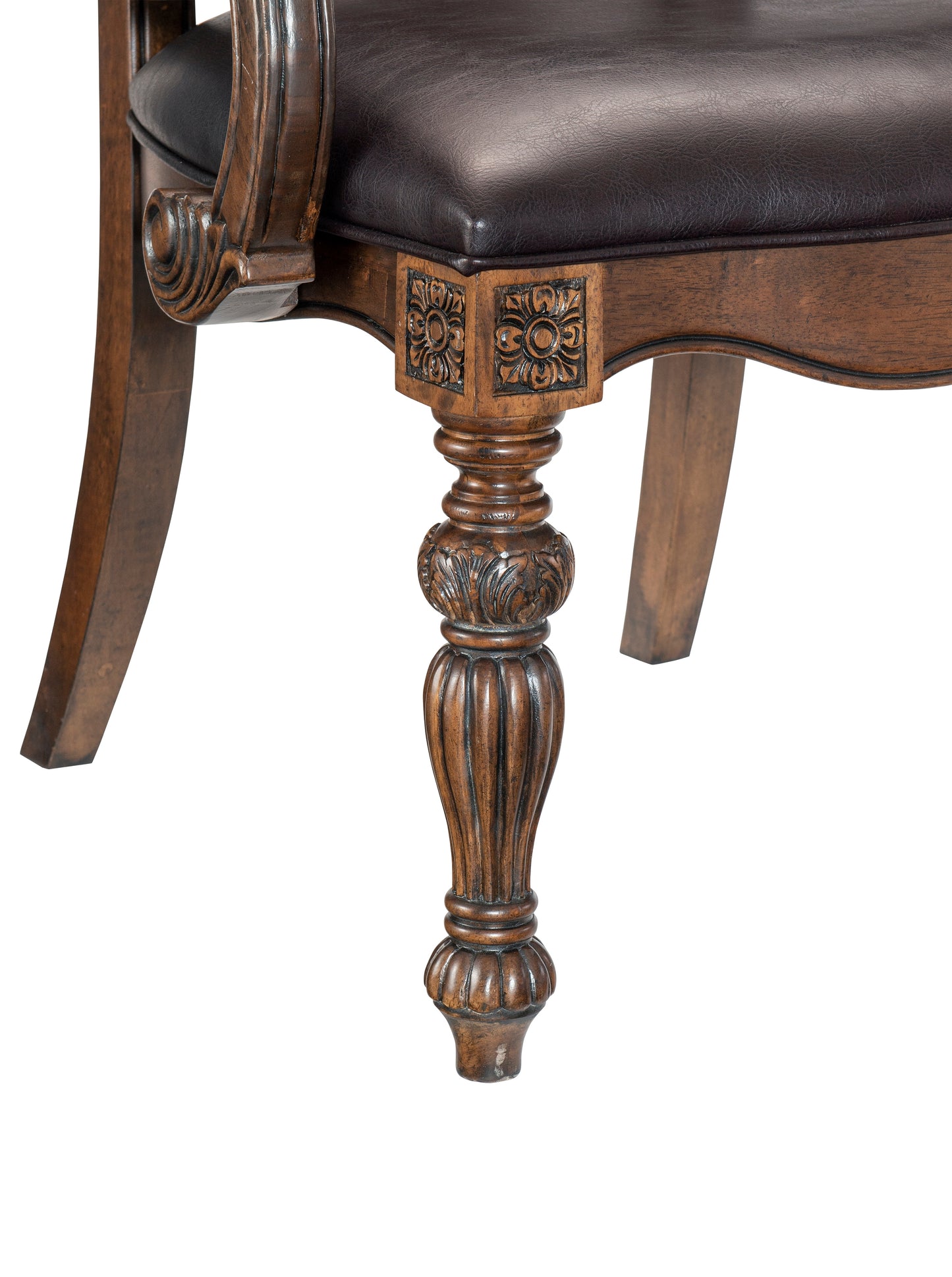 Dark brown faux leather upholstered chair seat with carved wooden leg
