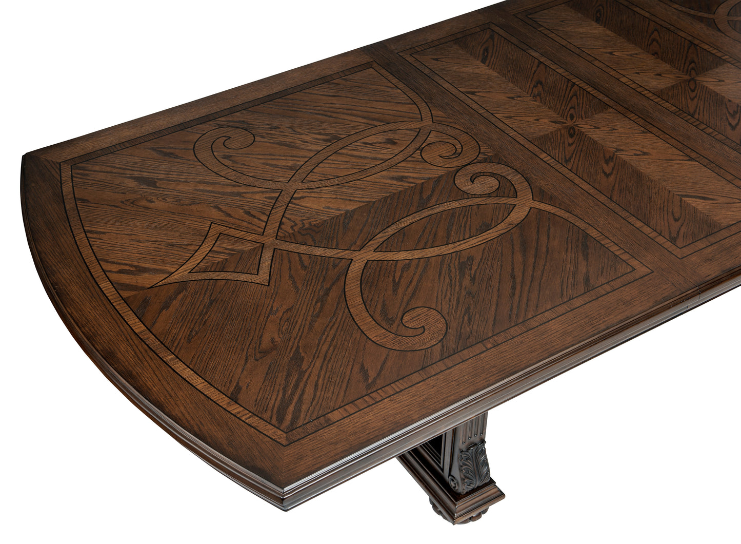 Dark oak dining table with ornate inlay and carved pedestal