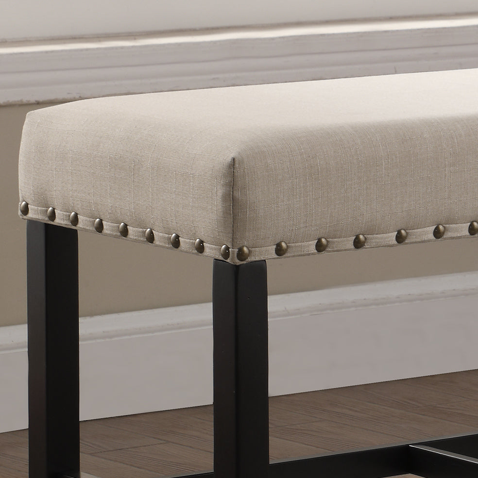 Upholstered dining bench in beige linen with antique brass nailhead trim