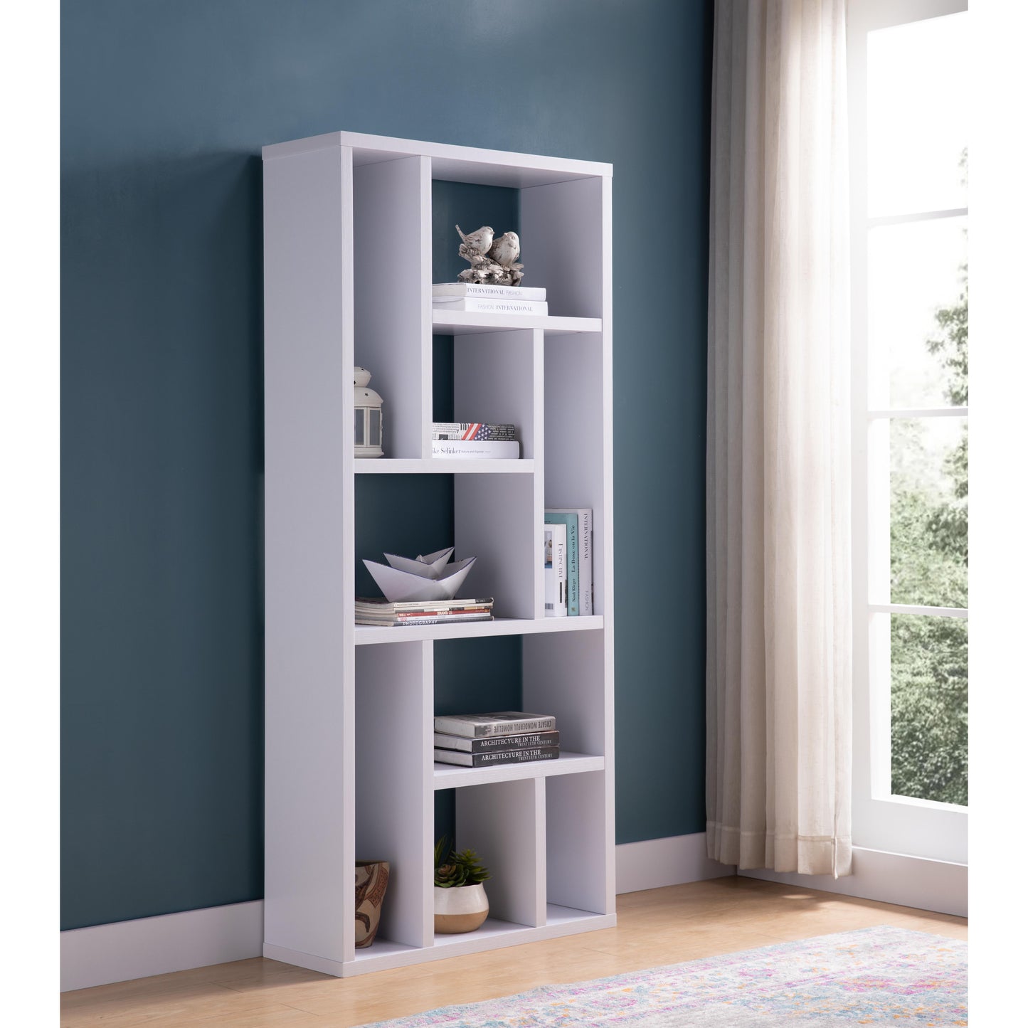 White modern bookshelf with varied shelf sizes