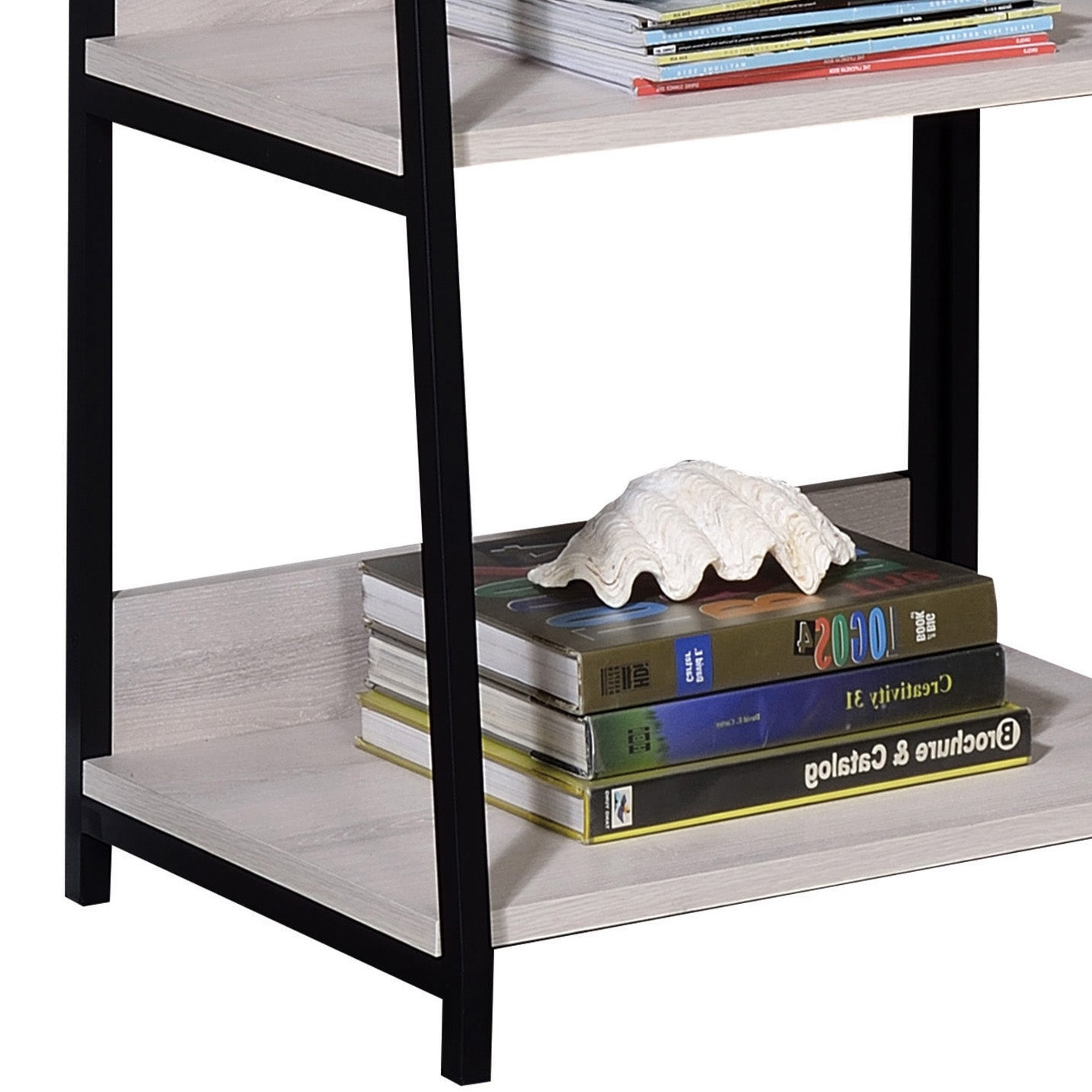 Modern bookshelf with light wood shelves and black metal frame holding books