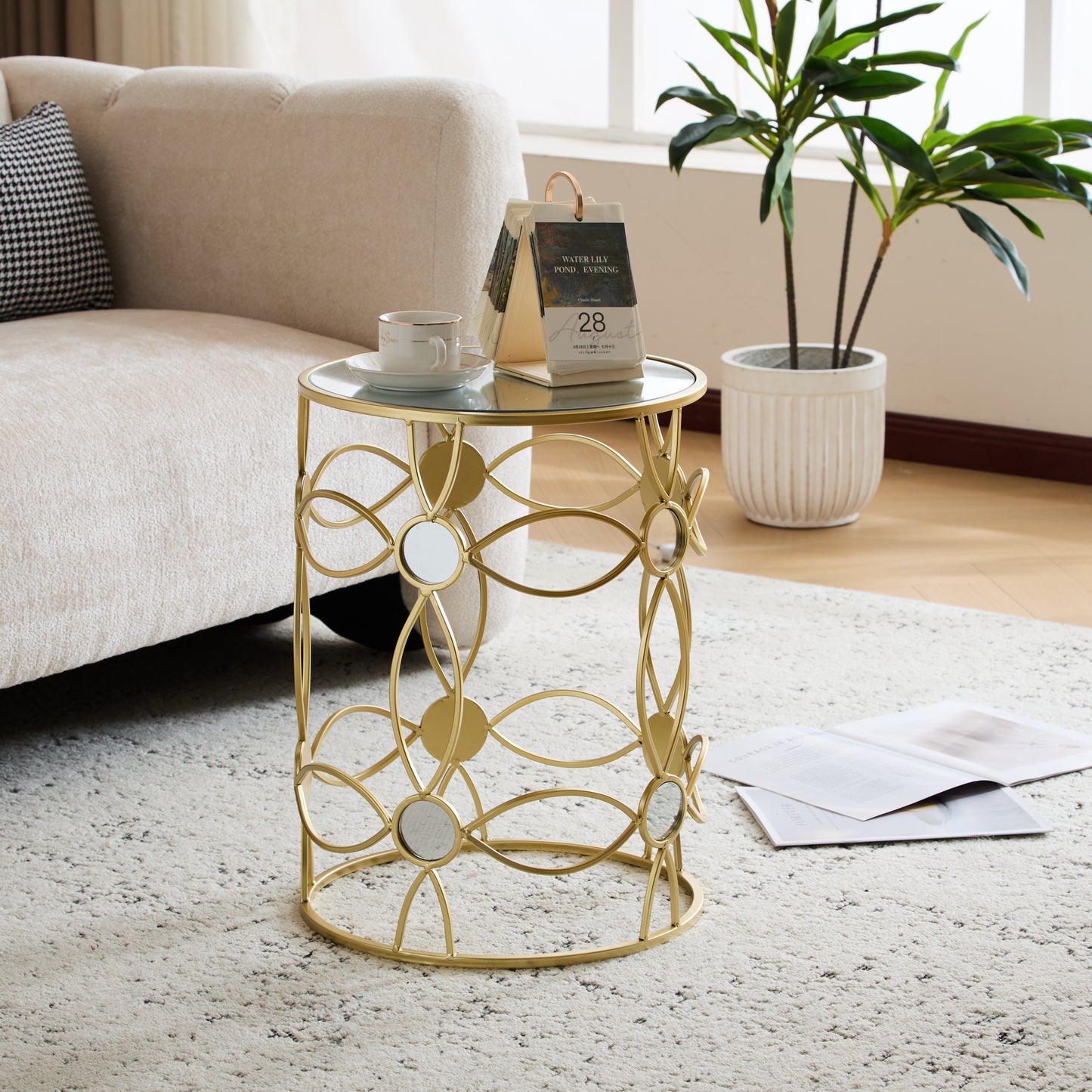 Round glass top gold accent side table with mirrored panels