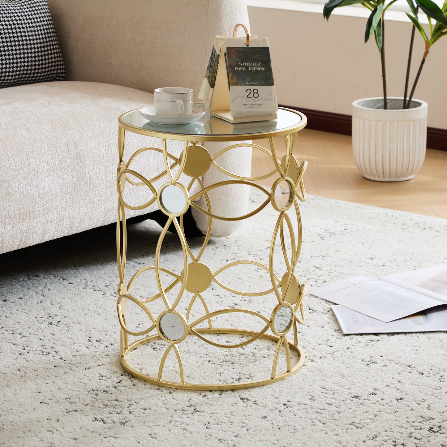 Gold metal end table with mirrored inlays and glass top