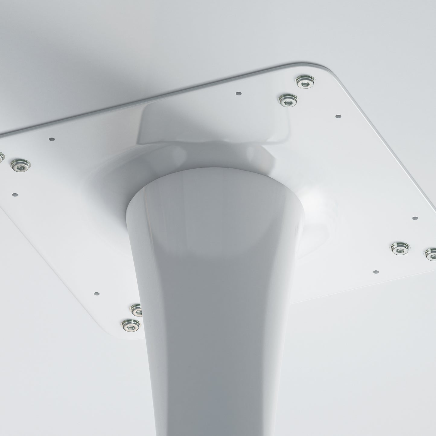 White metal table base with central support column and mounting plate