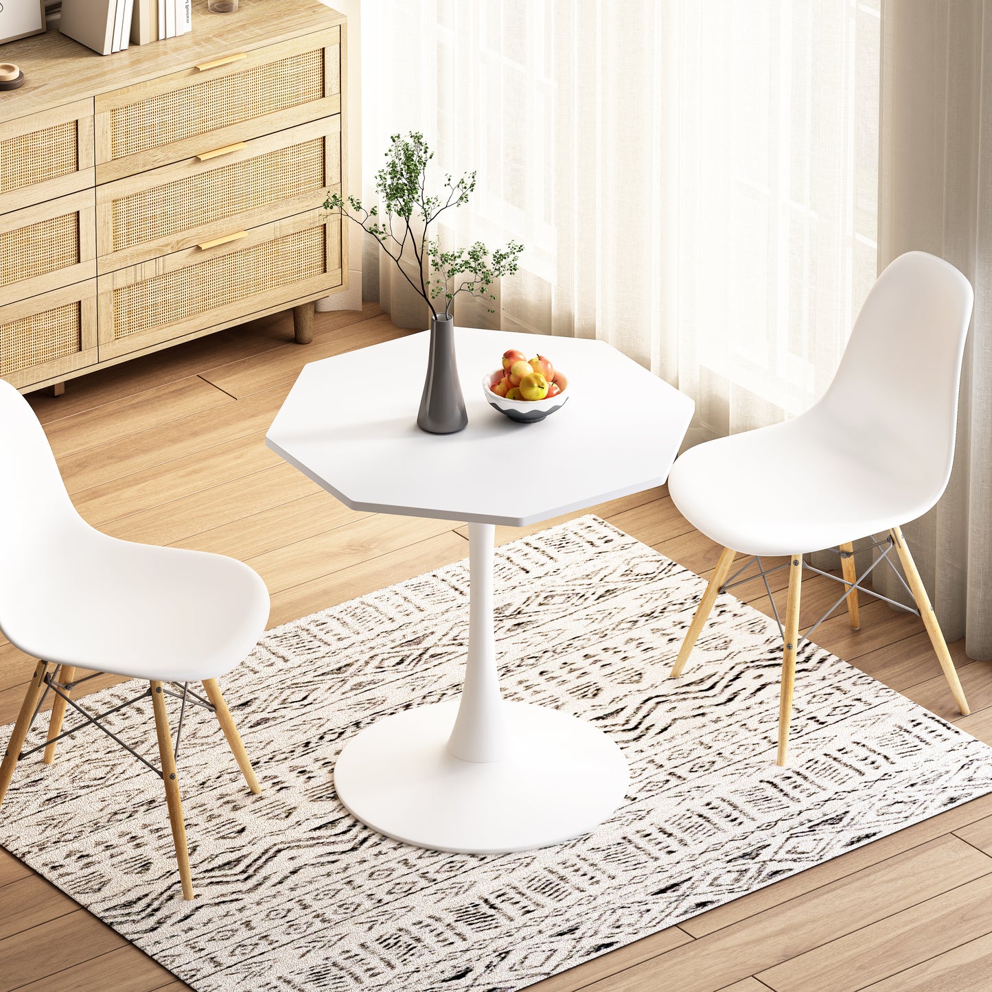 White octagonal pedestal dining table with two white chairs