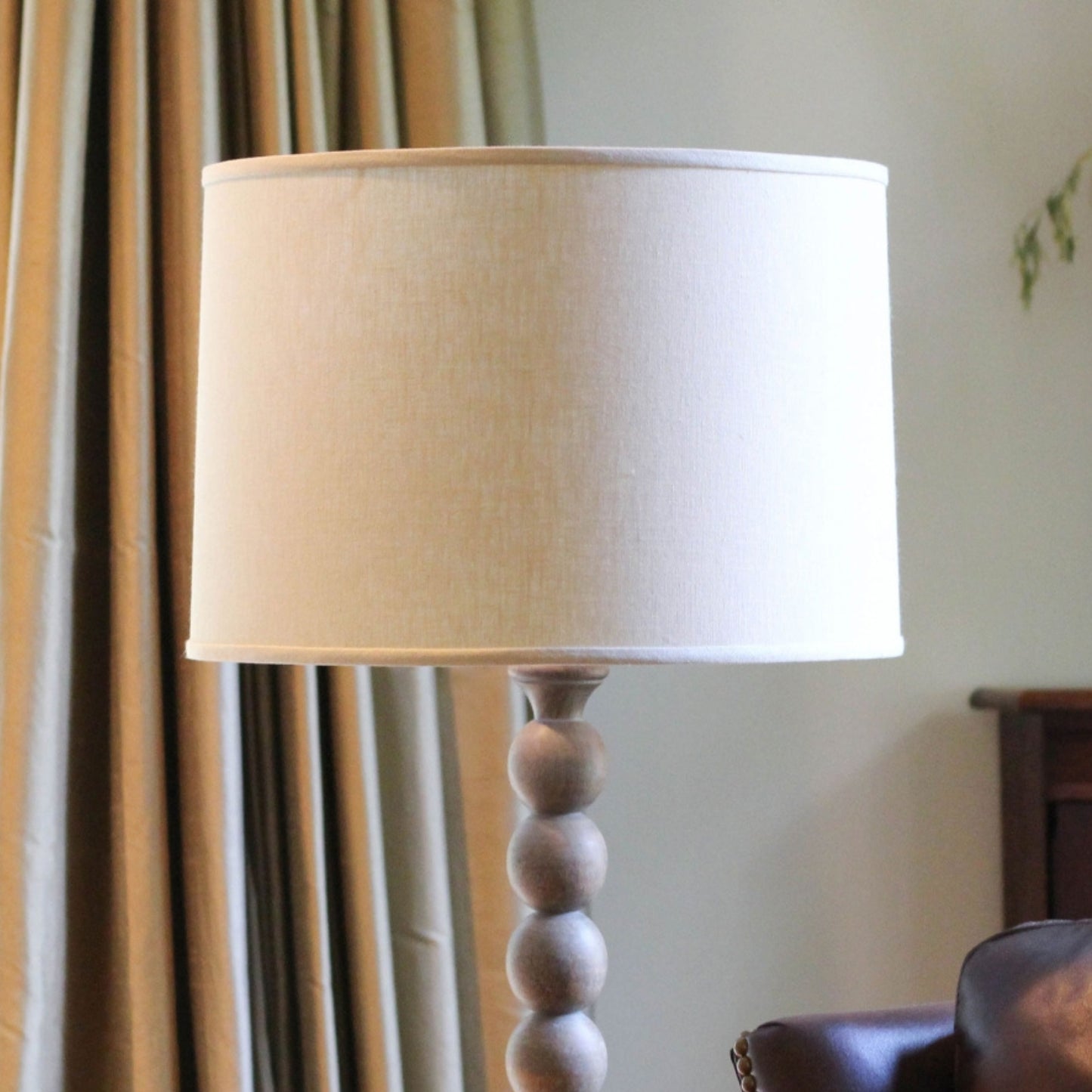 Cream drum lampshade with wooden beaded base