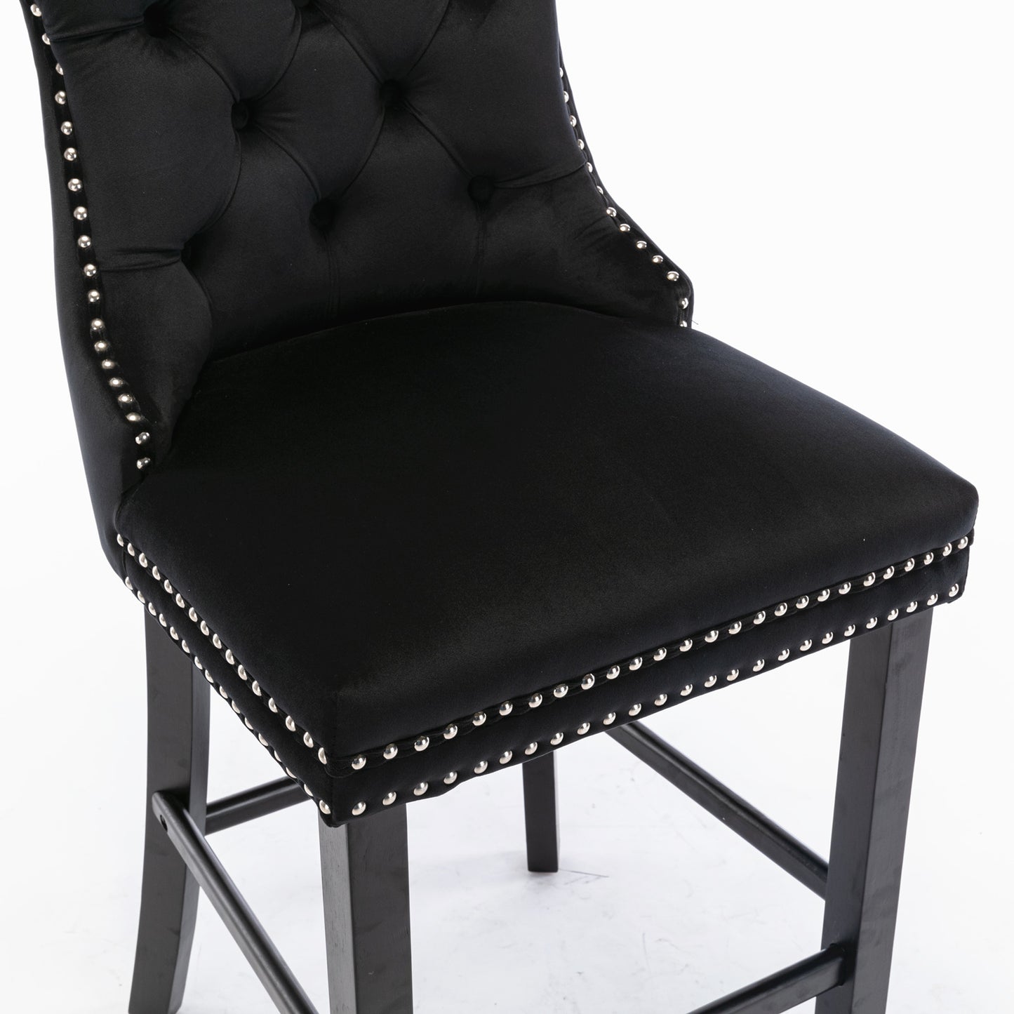 Black velvet bar stool with tufted back and silver nailhead trim