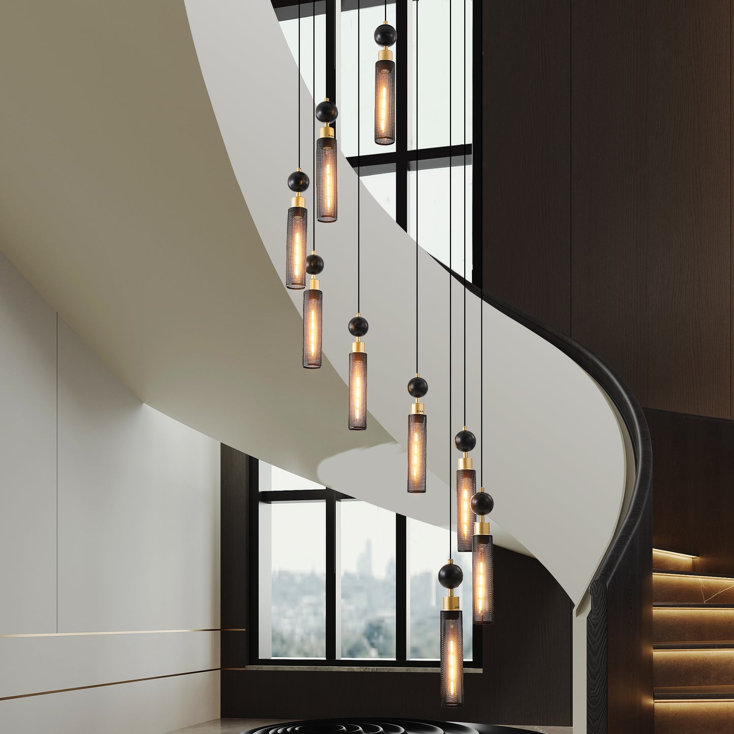Modern black and gold pendant lights with cylindrical mesh shades hanging in a grand staircase
