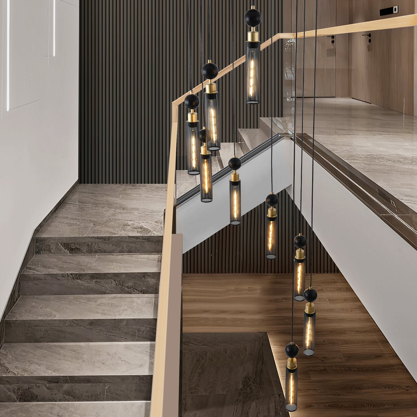 Modern black metal cylinder pendant light with brass accents and a black sphere detail