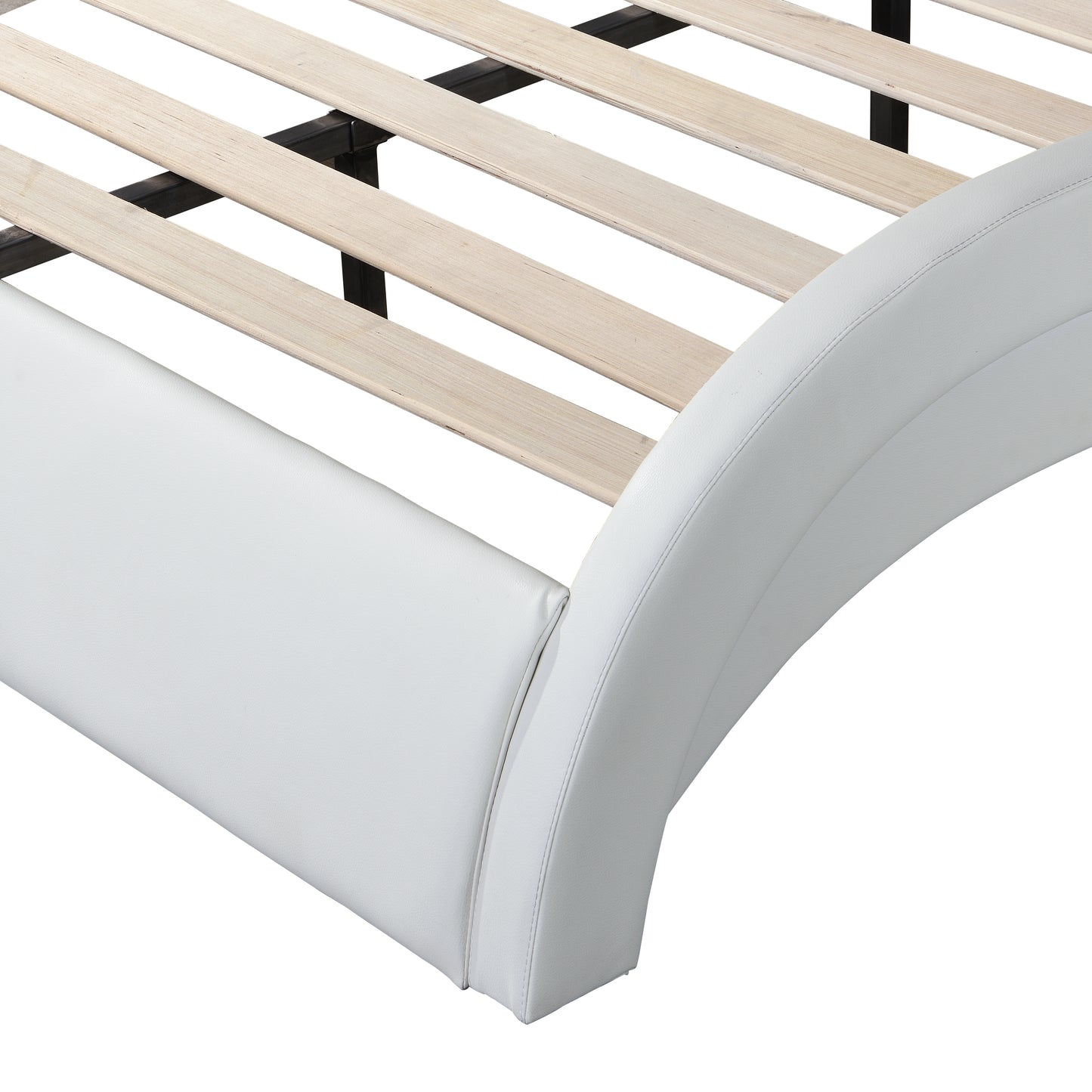 Closeup of white faux leather bed frame with curved headboard detail and wooden slats