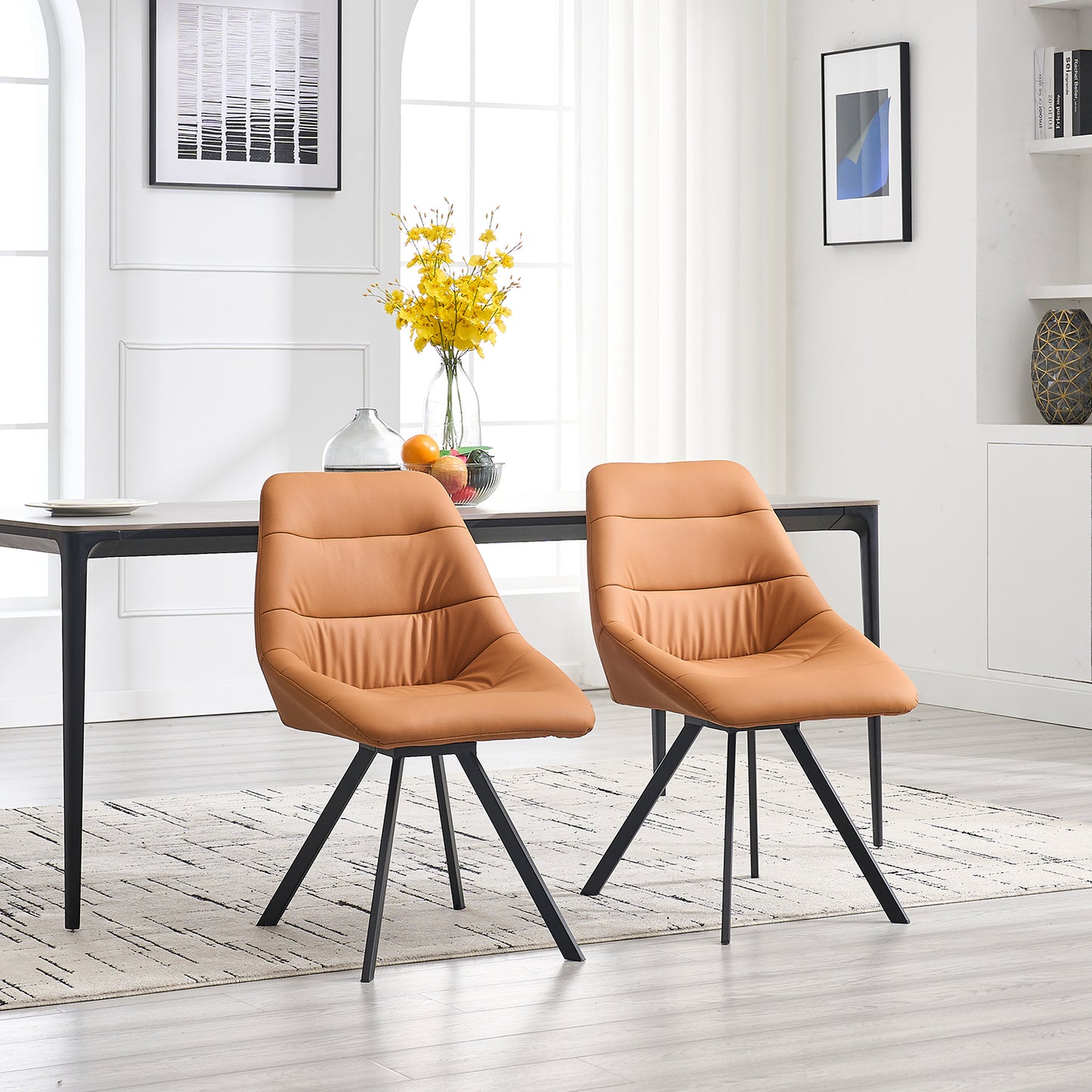 Two modern brown faux leather dining chairs with black metal legs
