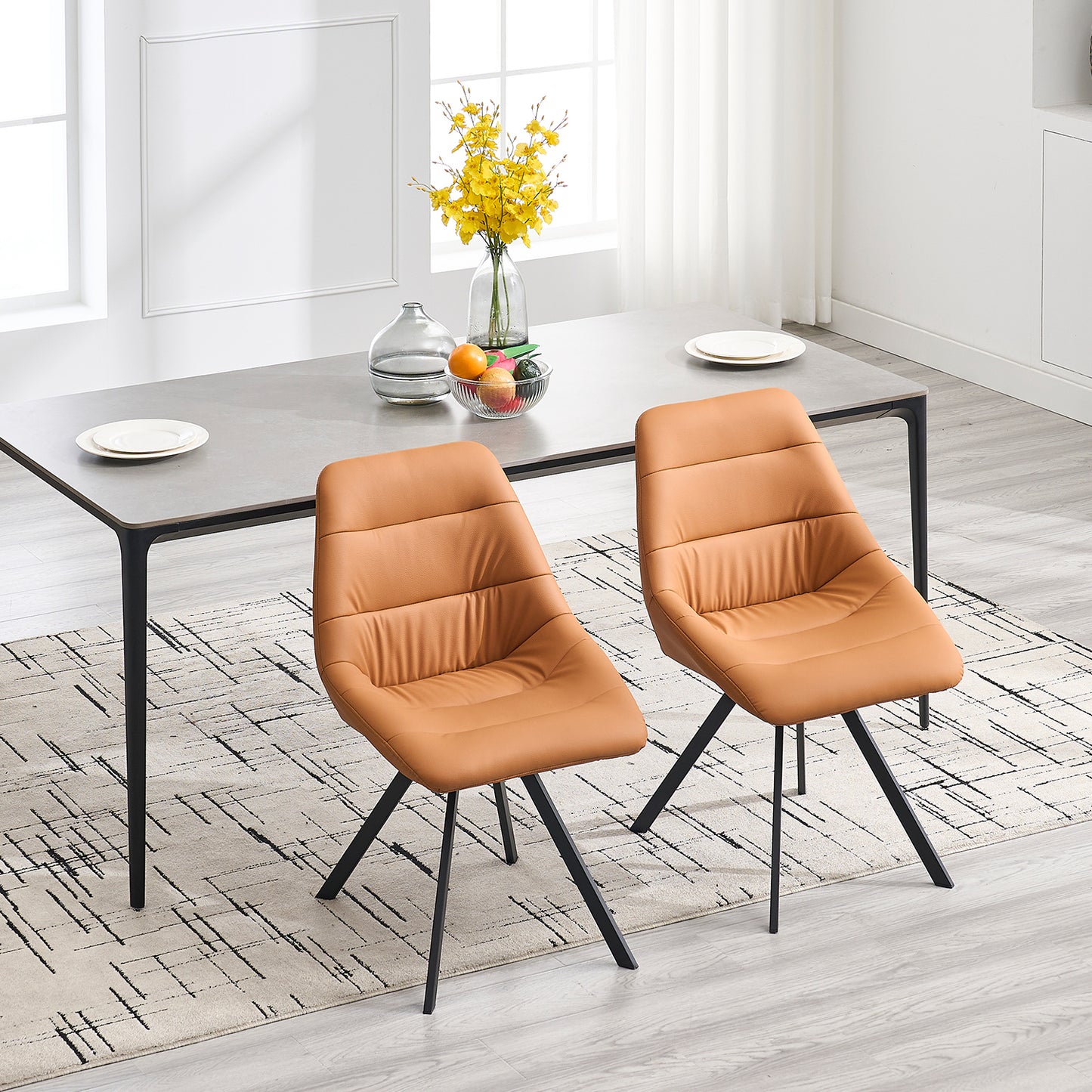 Tan faux leather dining chair with quilted seat and modern black legs