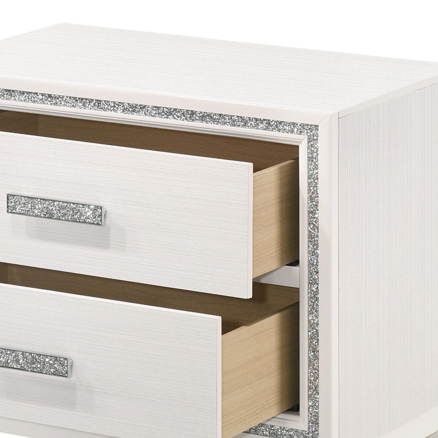 White dresser with crystalinlaid drawer pulls and decorative trim