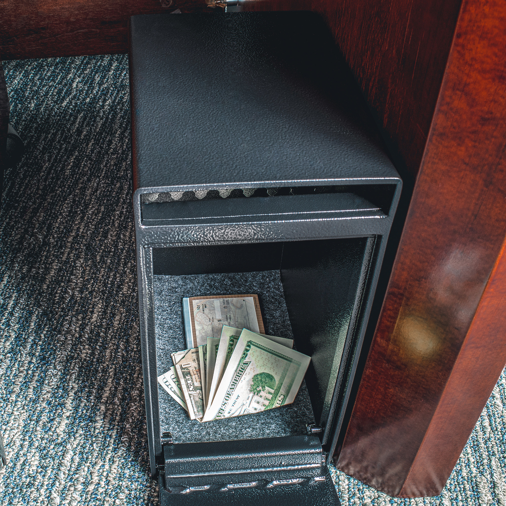 Black metal security safe with cash and checks