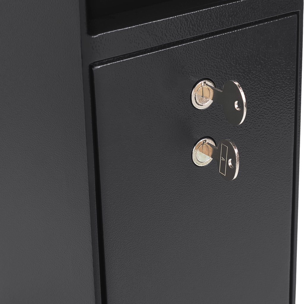Black metal safe with two keys inserted into locks