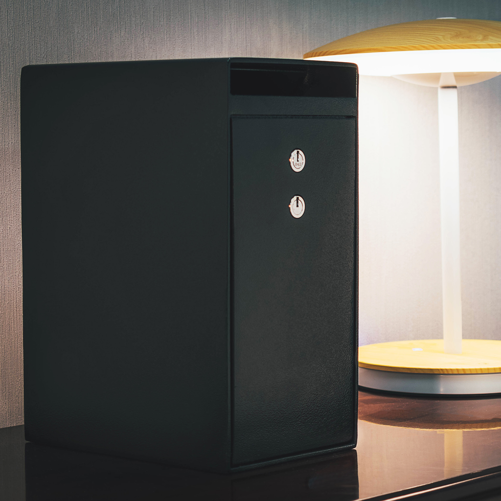 Black leather home safe with dual key locks and a mail slot