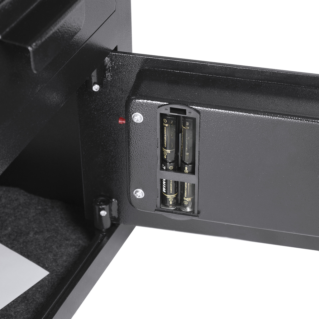 Black metal safe interior with battery compartment holding four AA batteries
