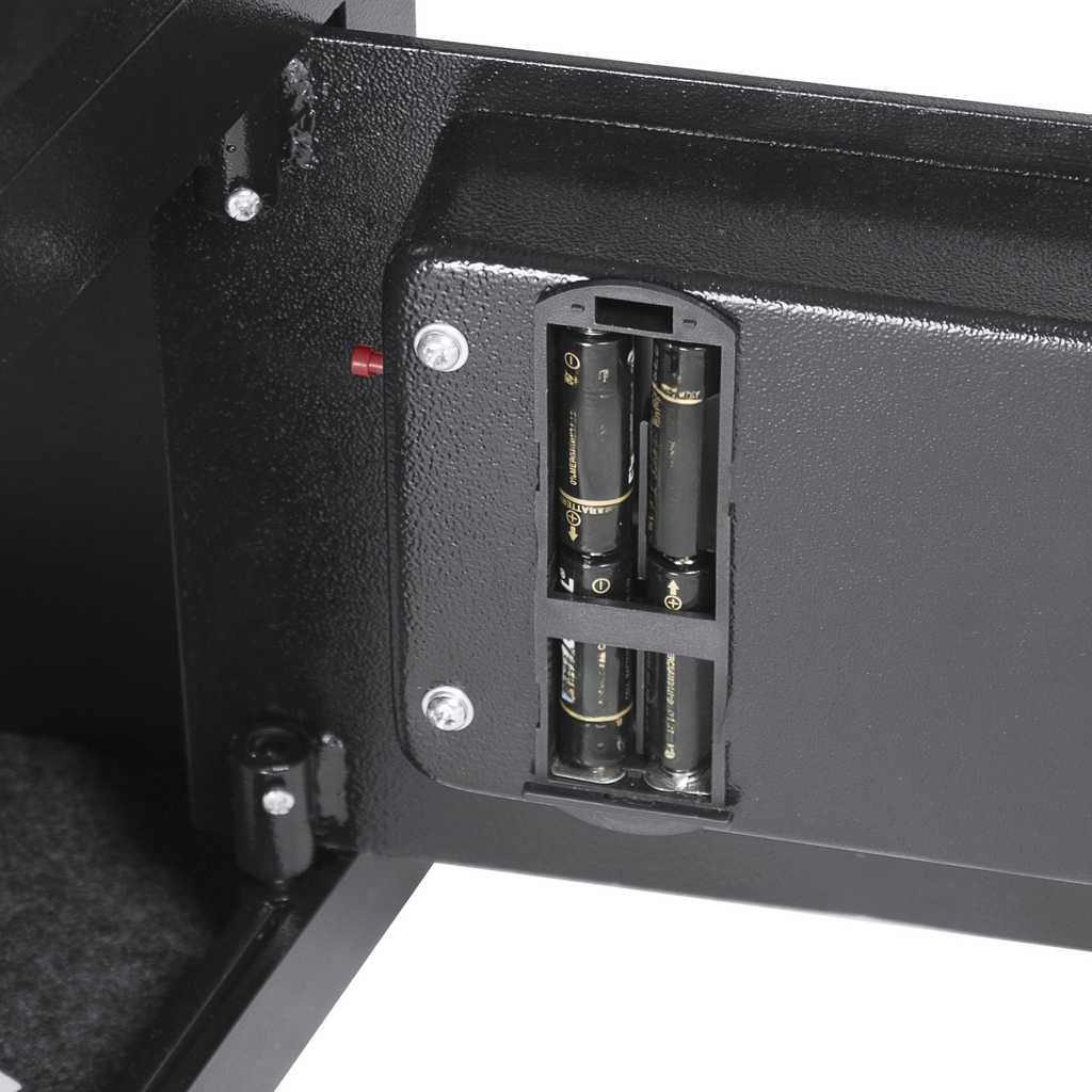 Closeup of battery compartment of a black digital safe
