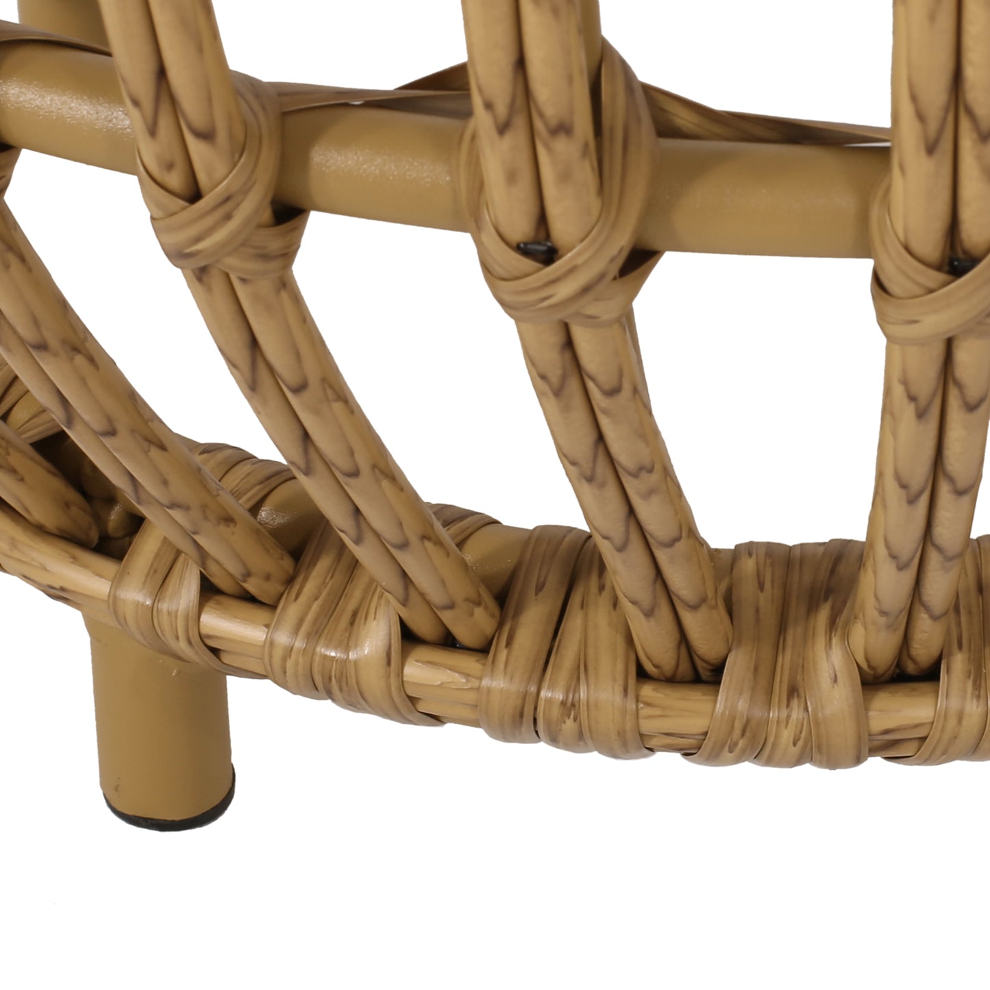Closeup of woven rattan chair base with goldenbrown hue