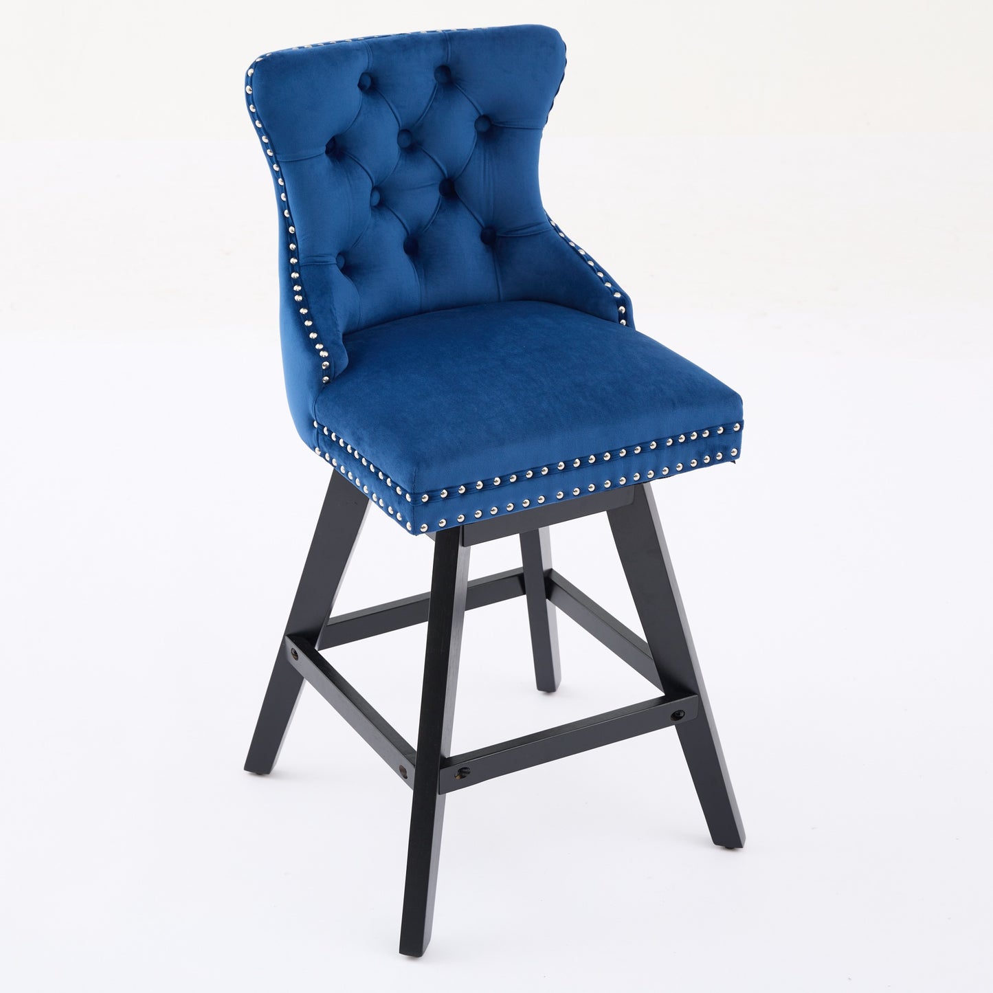 Blue velvet tufted swivel bar stool with silver nailhead trim and black wood legs