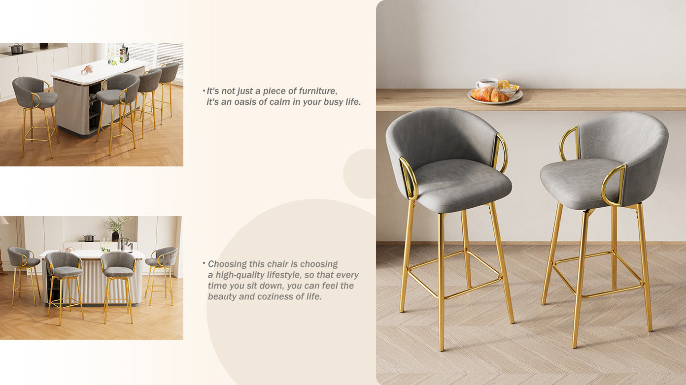 Two grey velvet bar stools with gold legs and armrests
