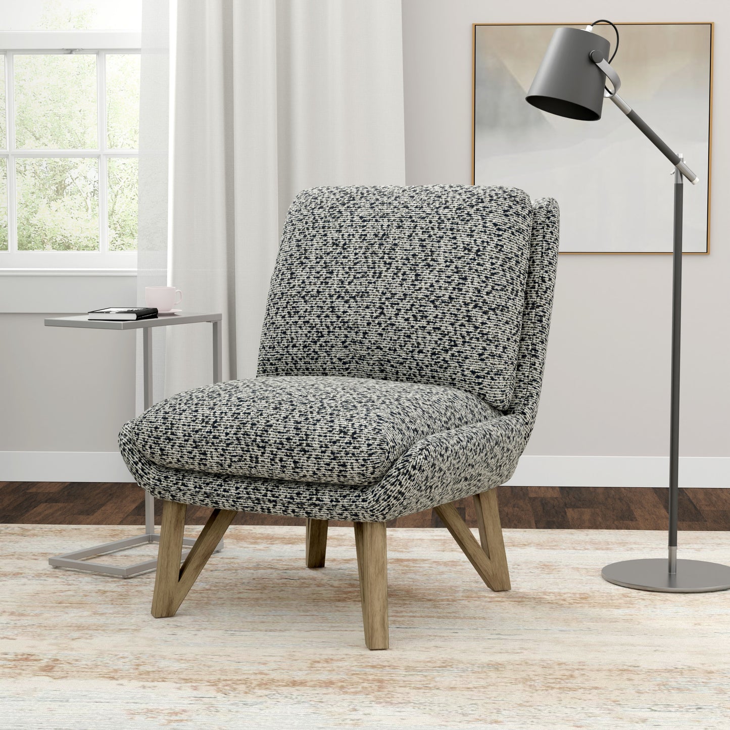 Black and white textured accent chair with wooden legs